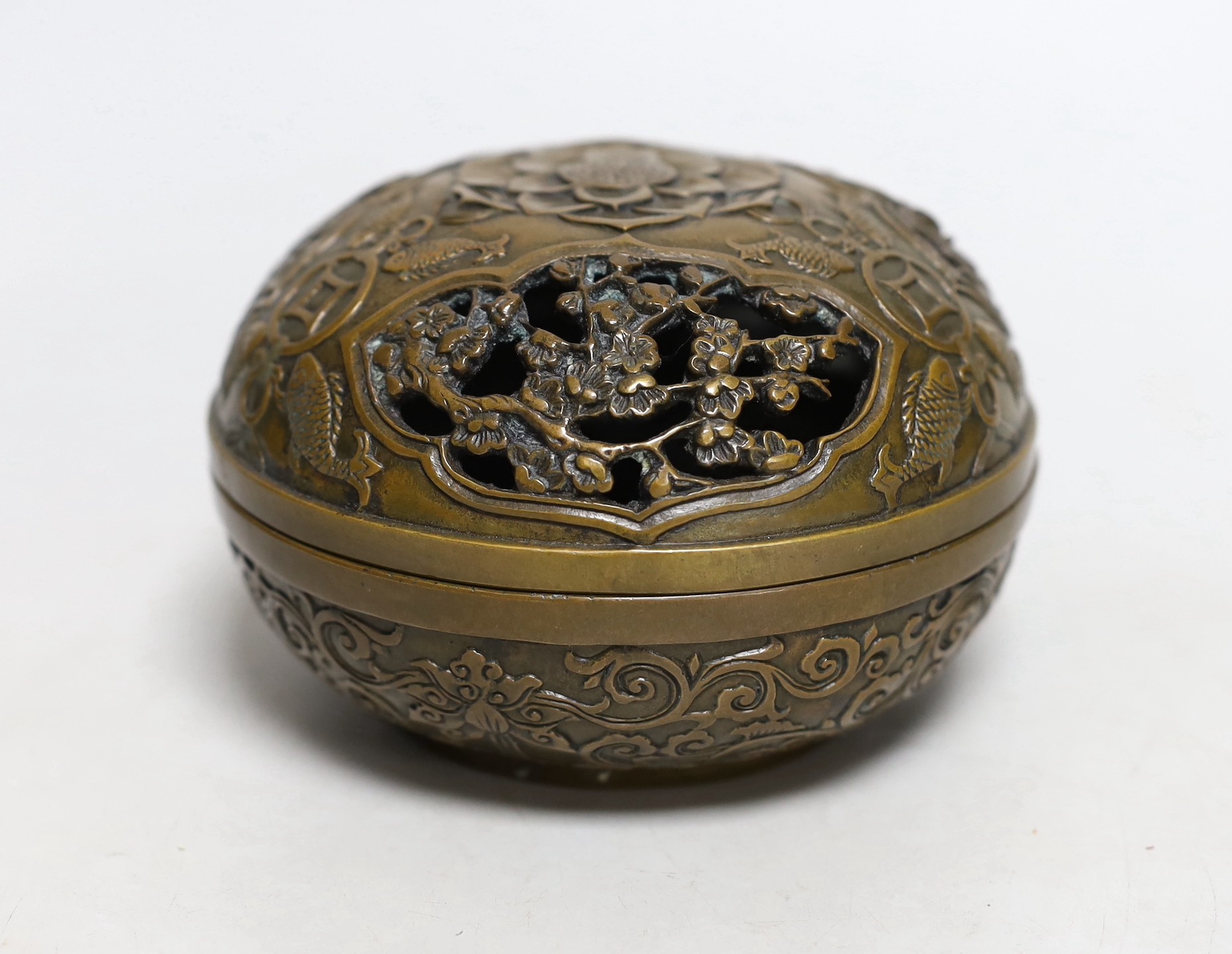 A Chinese circular carved bronze censer, 13.5cm diameter                                                                                                                                                                    