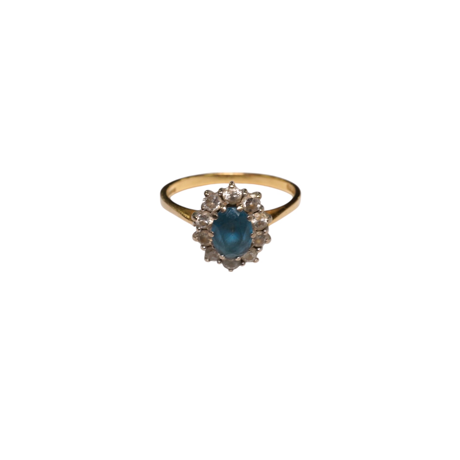 A modern 18ct gold, blue topaz and diamond set oval cluster ring, size M, gross weight 3.5 grams. Condition - fair                                                                                                          