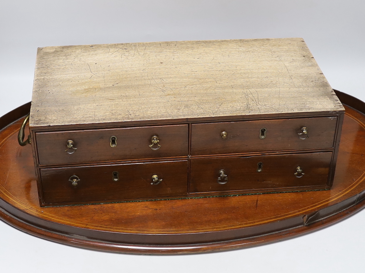 A small Georgian mahogany collector's chest and an Edwardian inlaid mahogany tray, the largest 68cm wide                                                                                                                    