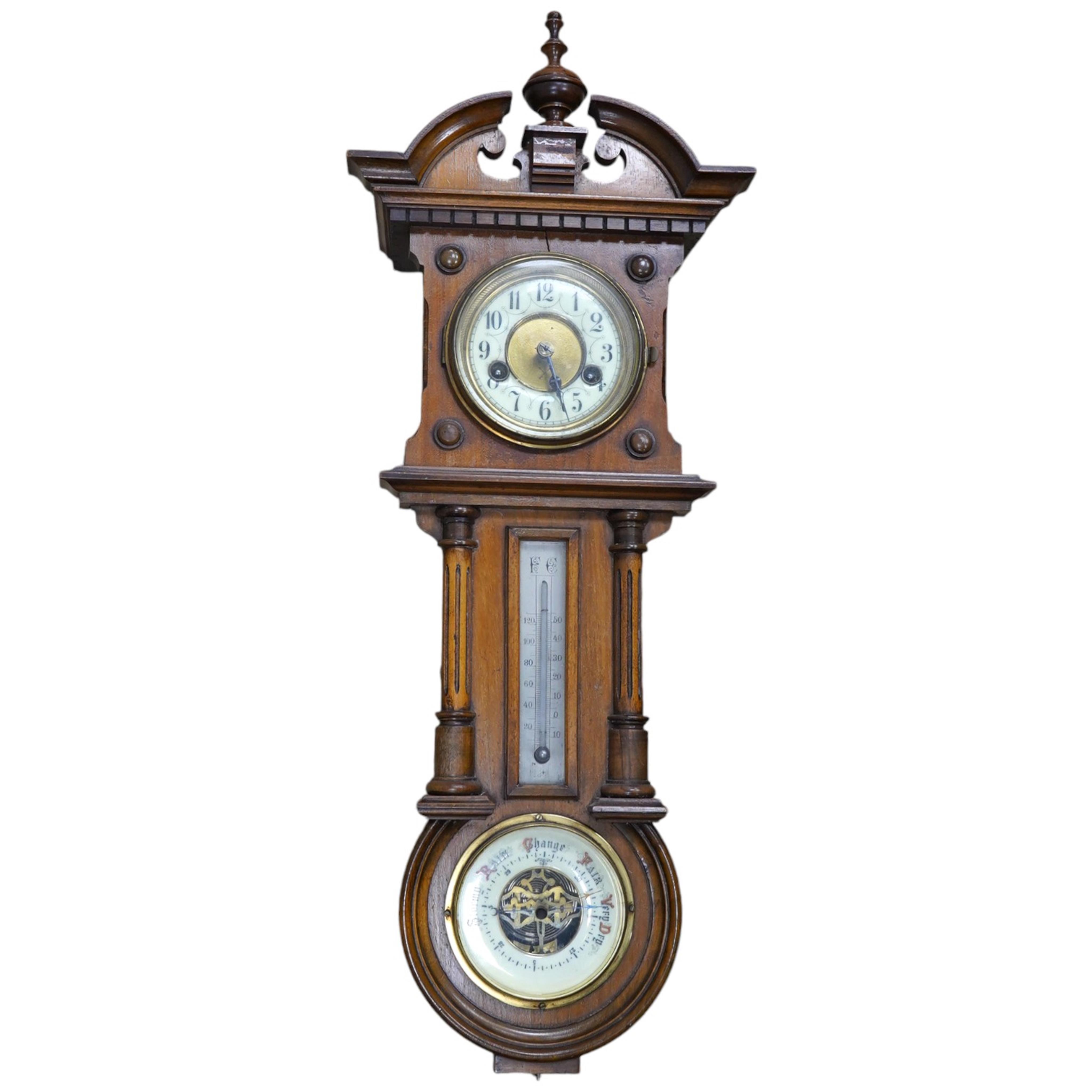 A late 19th century walnut wall clock, barometer and thermometer combination, striking on a coiled gong, 65cm high. Condition - fair, crack to the case and finial missing to the bottom                                    