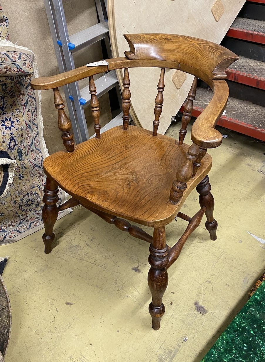 A Victorian beech and elm smoker's bow chair                                                                                                                                                                                