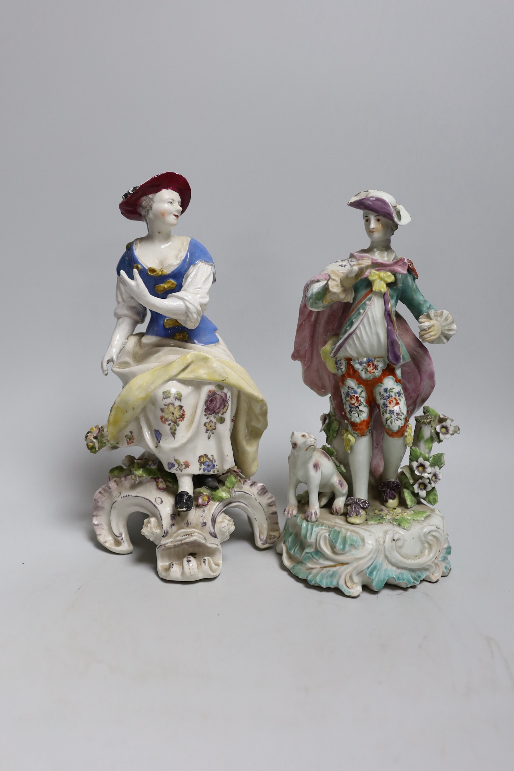 Two 18th century Derby figures: a seated lady and gentleman with a dog, 23cms high                                                                                                                                          