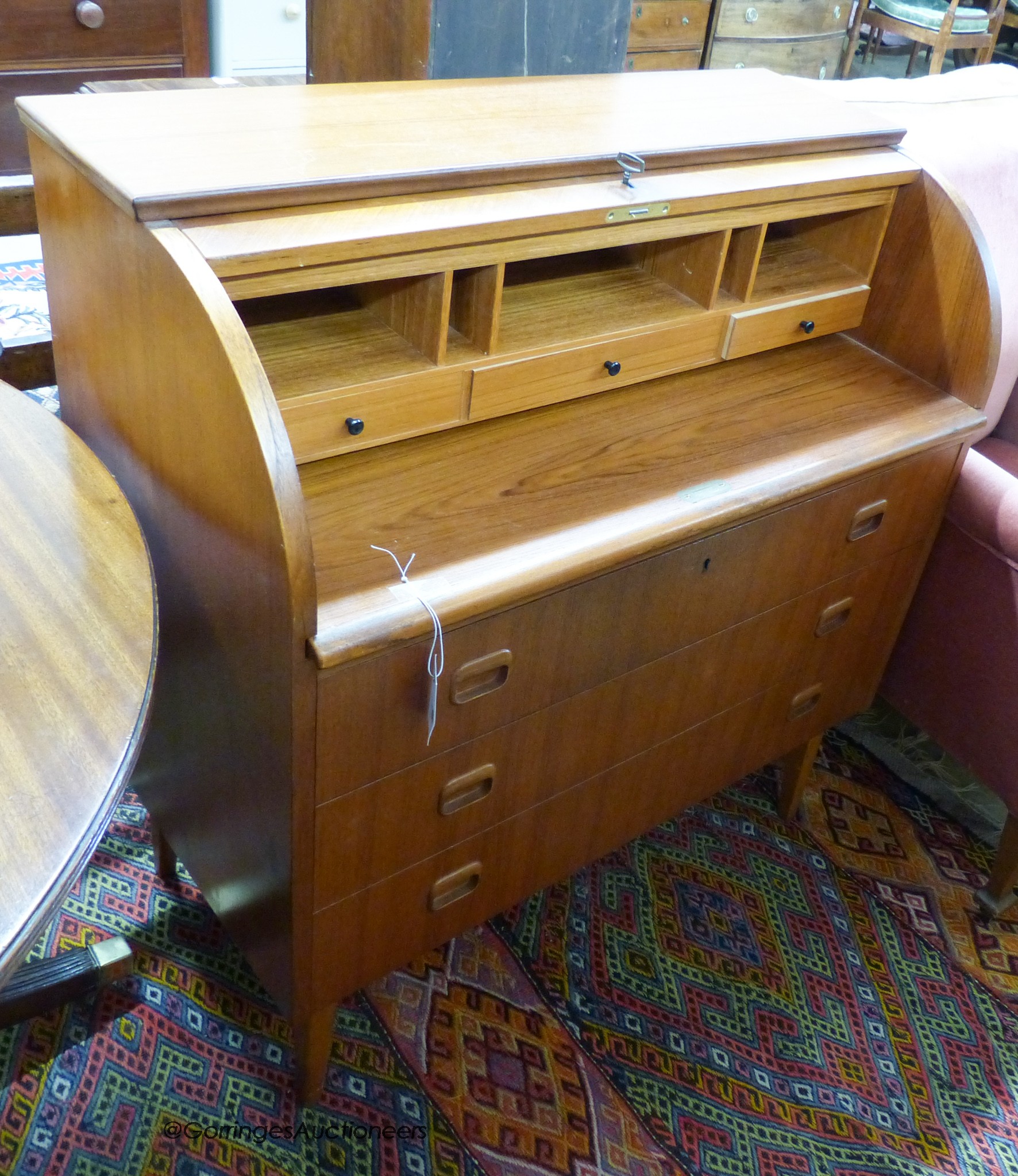 A mid century design teak cylinder bureau, width 90cm, depth 48cm, height 96cm                                                                                                                                              