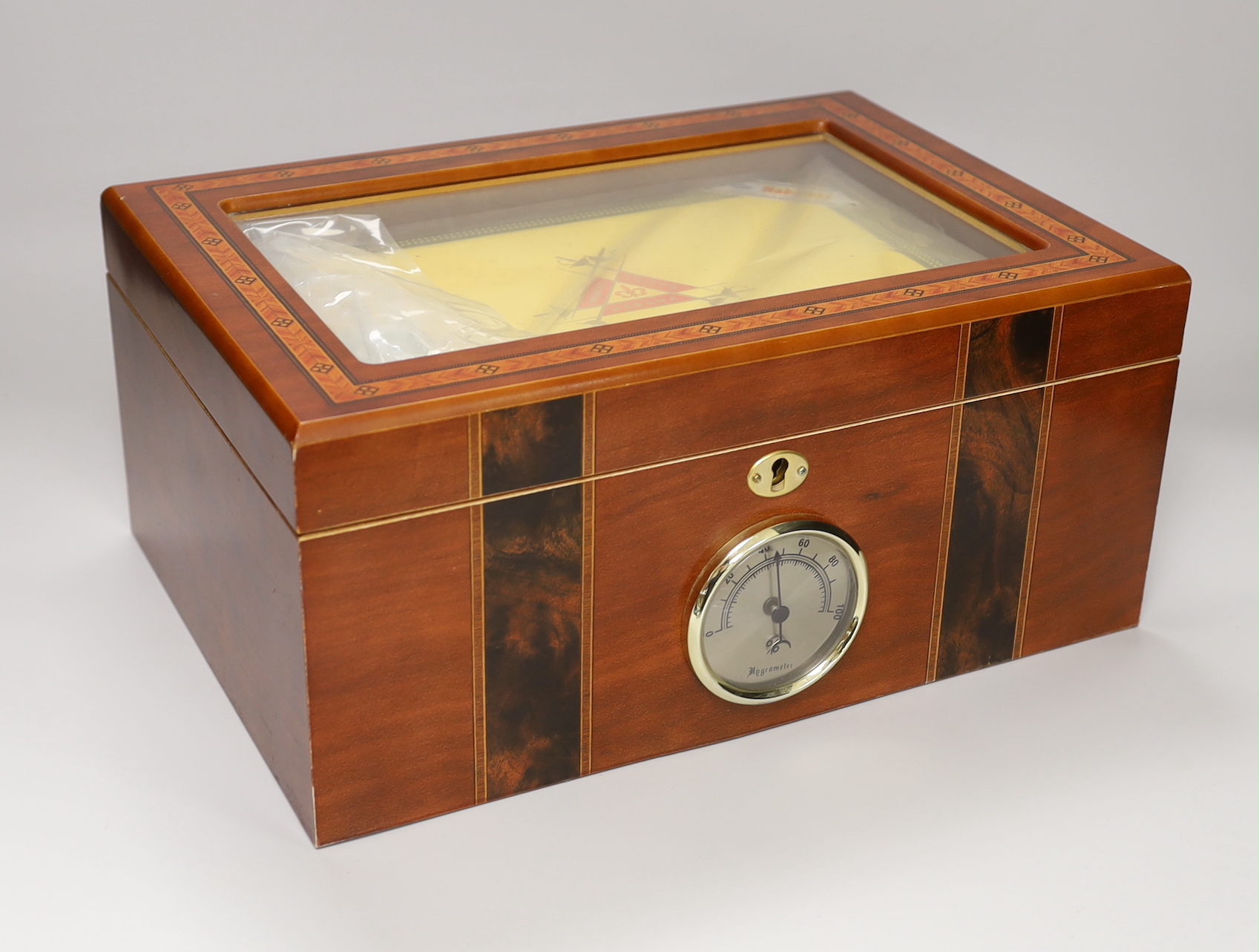 A sealed case of Monte Cristo Habana cigars together with a humidor, the humidor 16cm high x 34.5cm wide                                                                                                                    