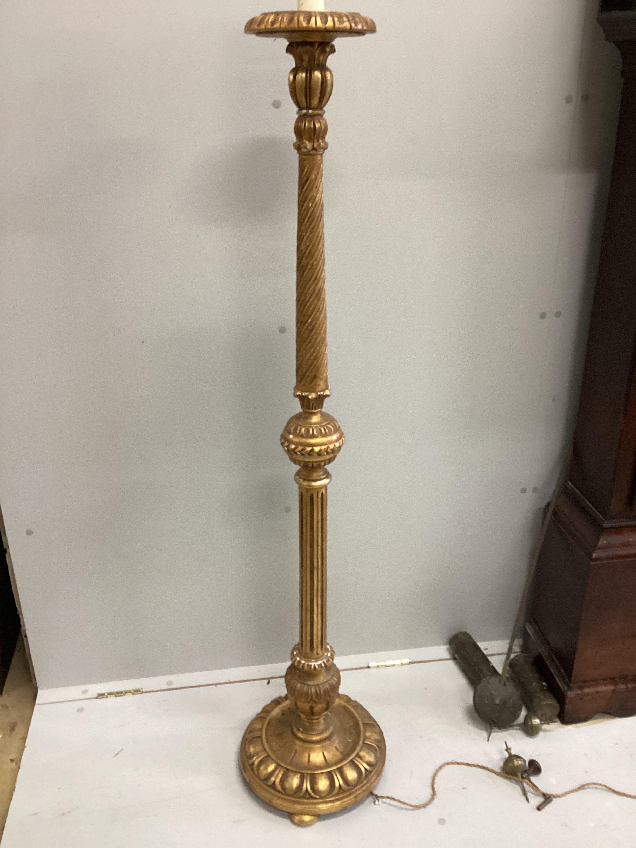 A carved giltwood and composition standard lamp, height 164cm.                                                                                                                                                              