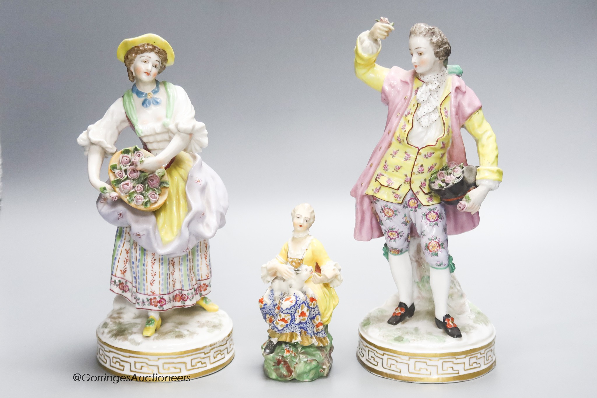 A pair of Continental porcelain figures and smaller, English figure                                                                                                                                                         