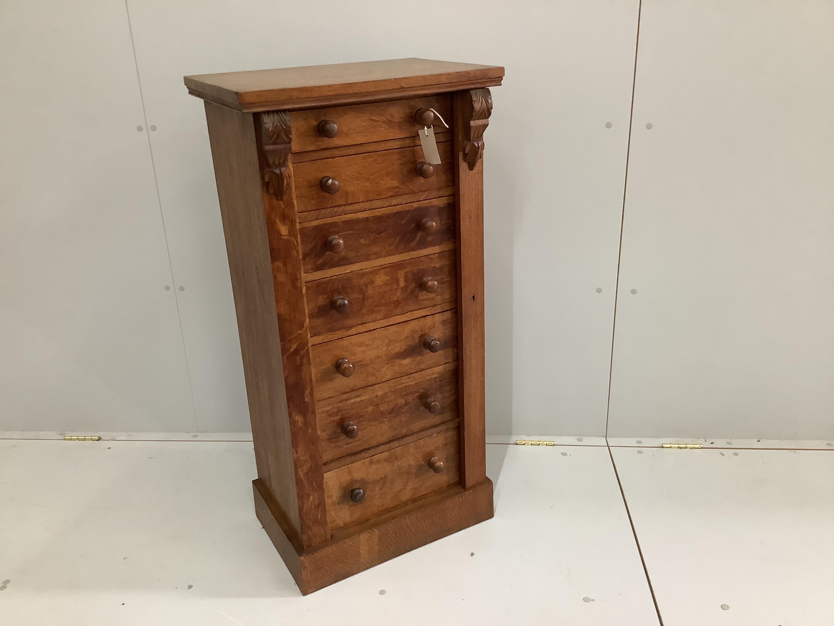 A Victorian oak Wellington chest, width 53cm, depth 36cm, height 107cm                                                                                                                                                      