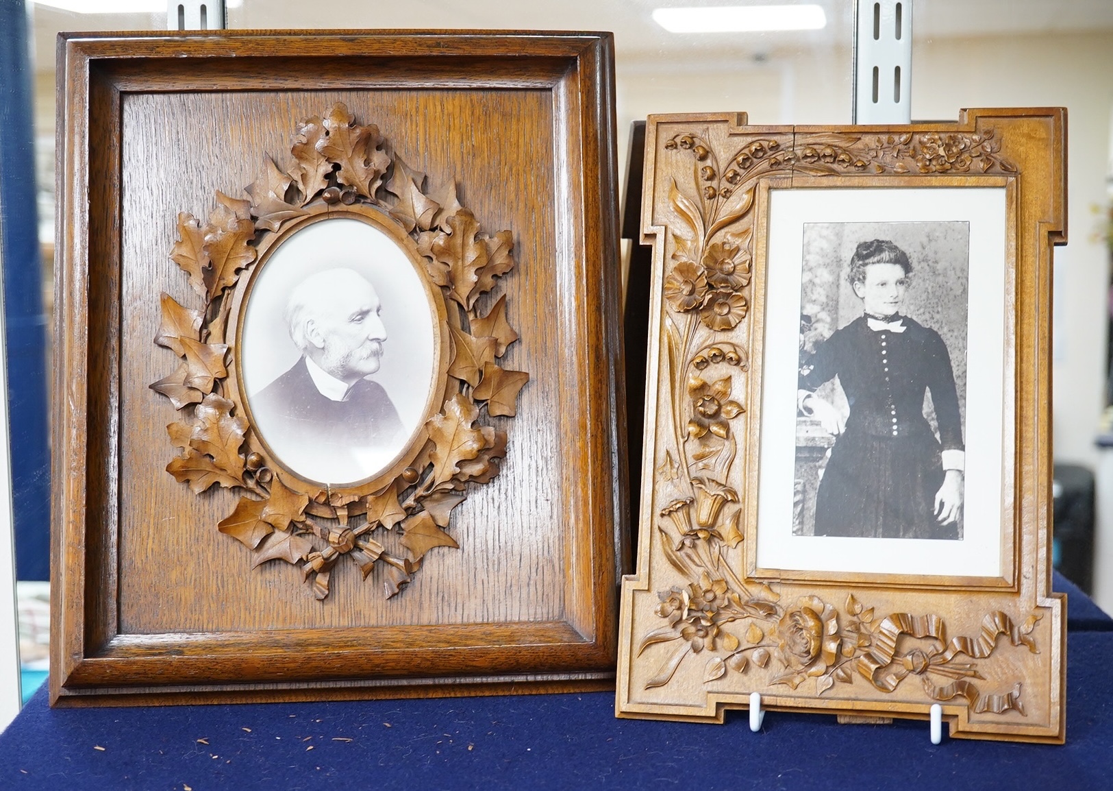 An oak photograph frame carved by Alfred Jones, another similar frame - related (his wife), 33cm high x 23cm wide, and a wall bracket carved by Alfred Jones and cased medal awarded to him, A Jones by The Carpenters Compa