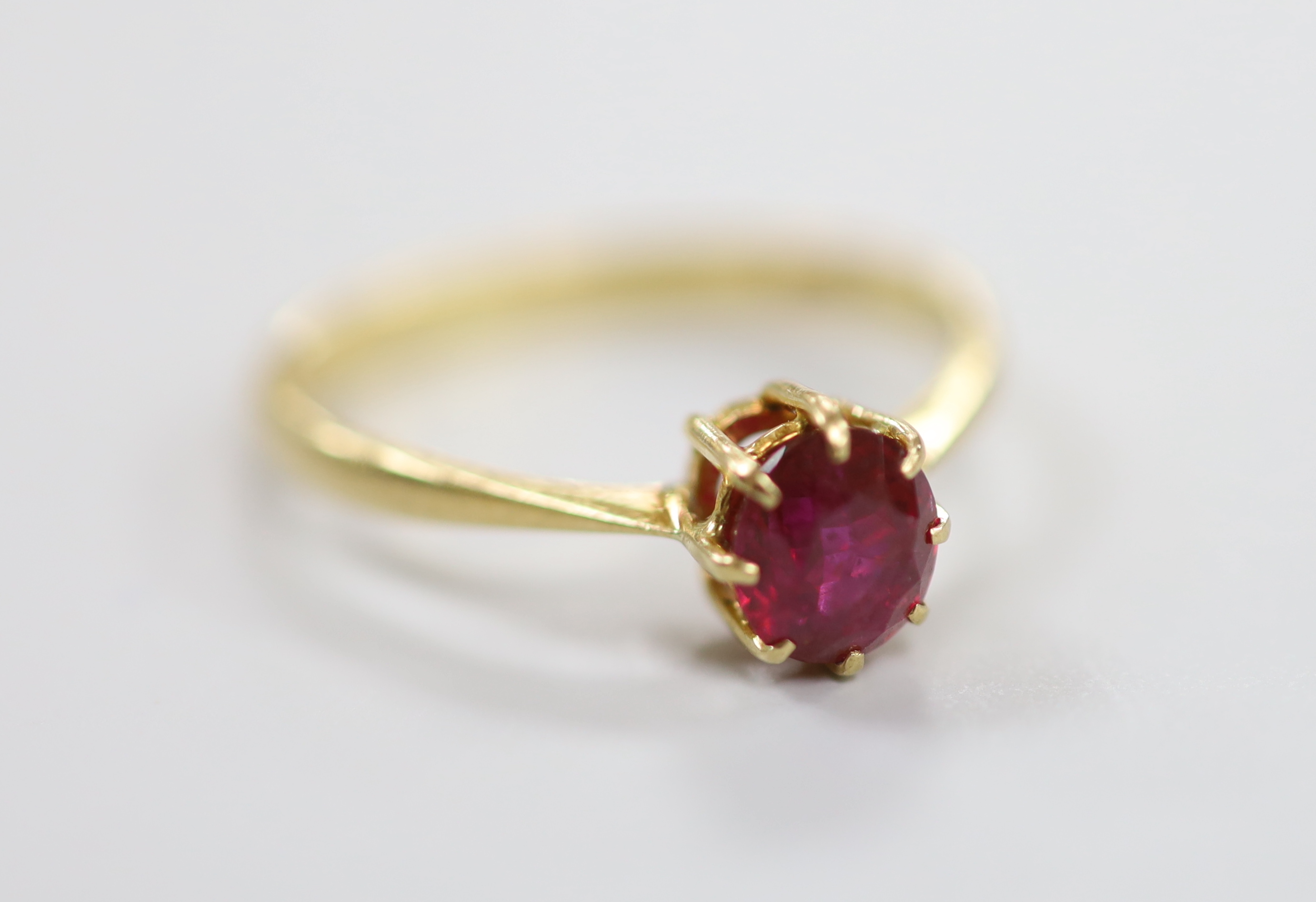 A 1960's 18ct gold and solitaire ruby set ring, size O, gross weight 2.2 grams.                                                                                                                                             