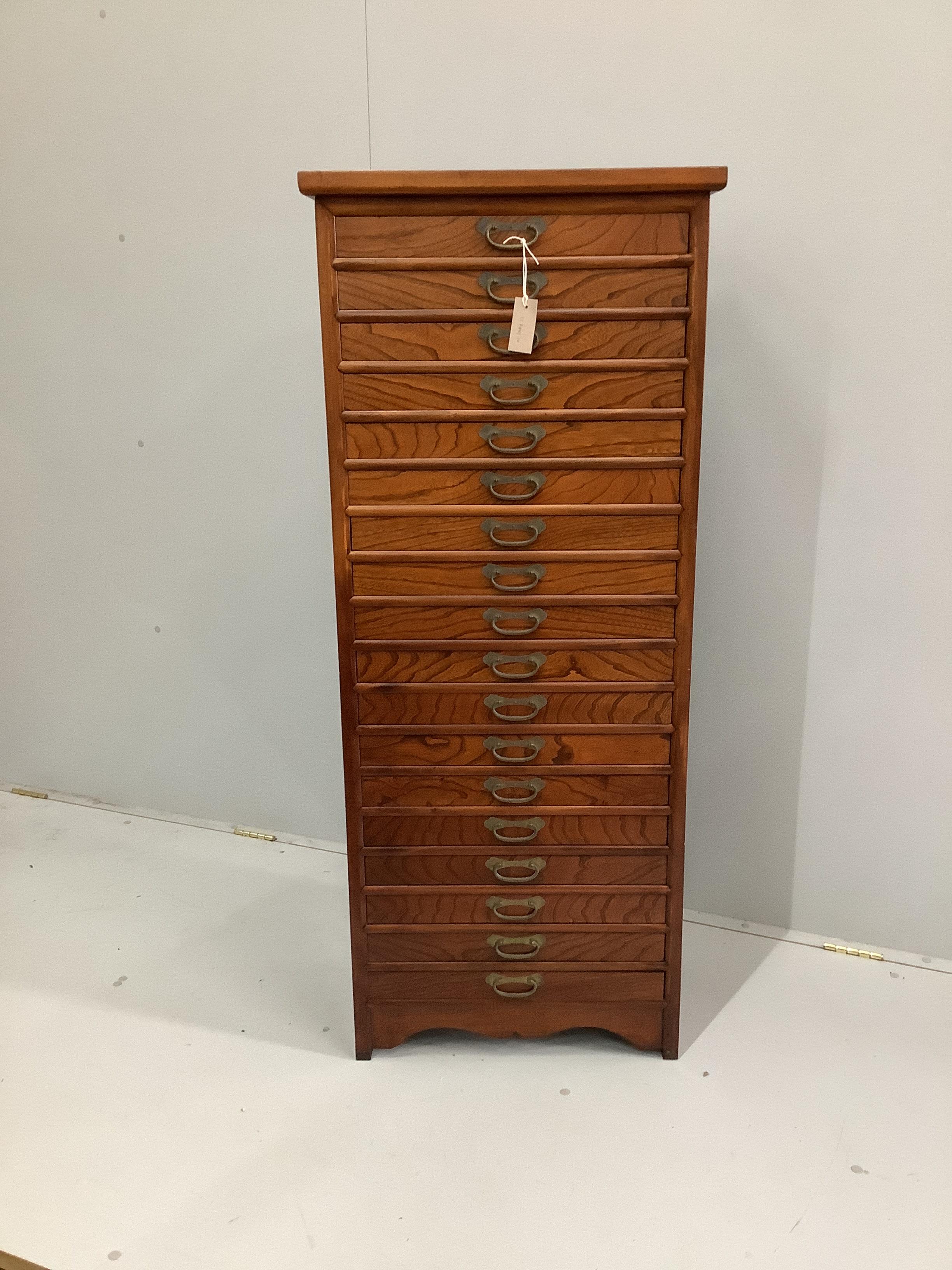 A Chinese elm eighteen drawer tall chest, width 56cm, depth 34cm, height 136cm                                                                                                                                              