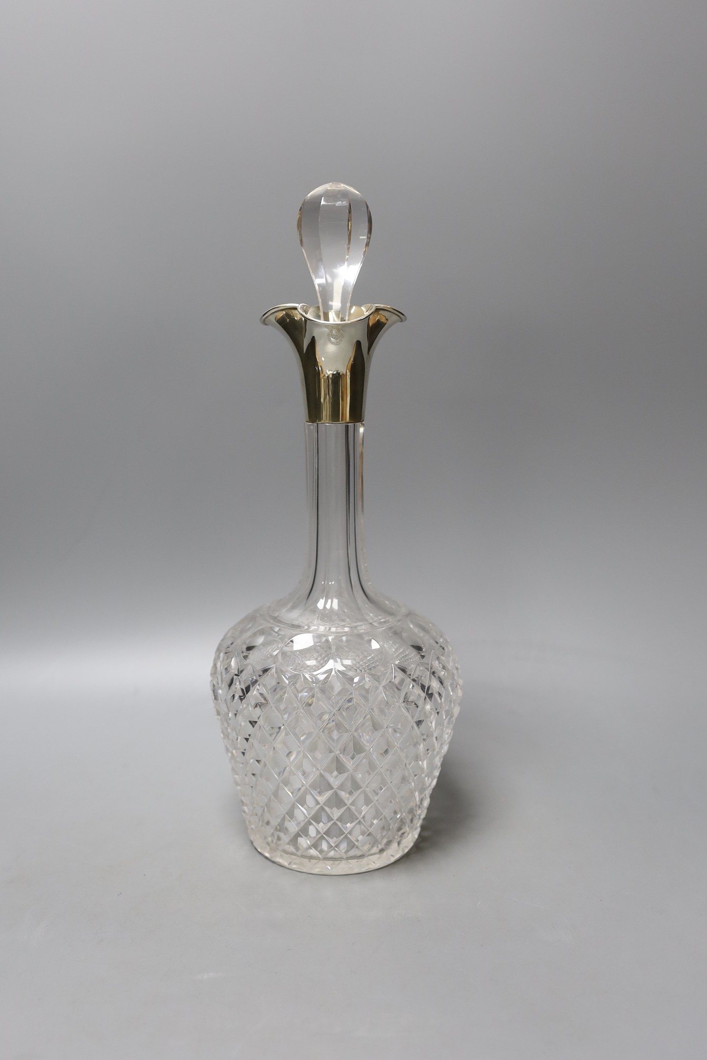 A late Victorian silver mounted cut glass decanter and stopper, John Grinsell & Sons, London, 1900, 35.5cm.                                                                                                                 