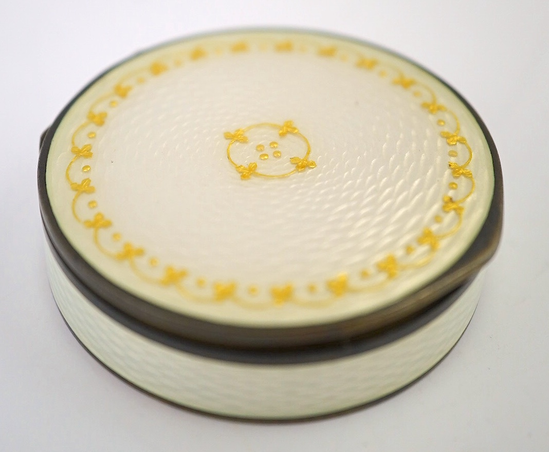 An early 20th century Scandinavian silver and enamel circular pill box, 4.2cm. Condition - poor.                                                                                                                            