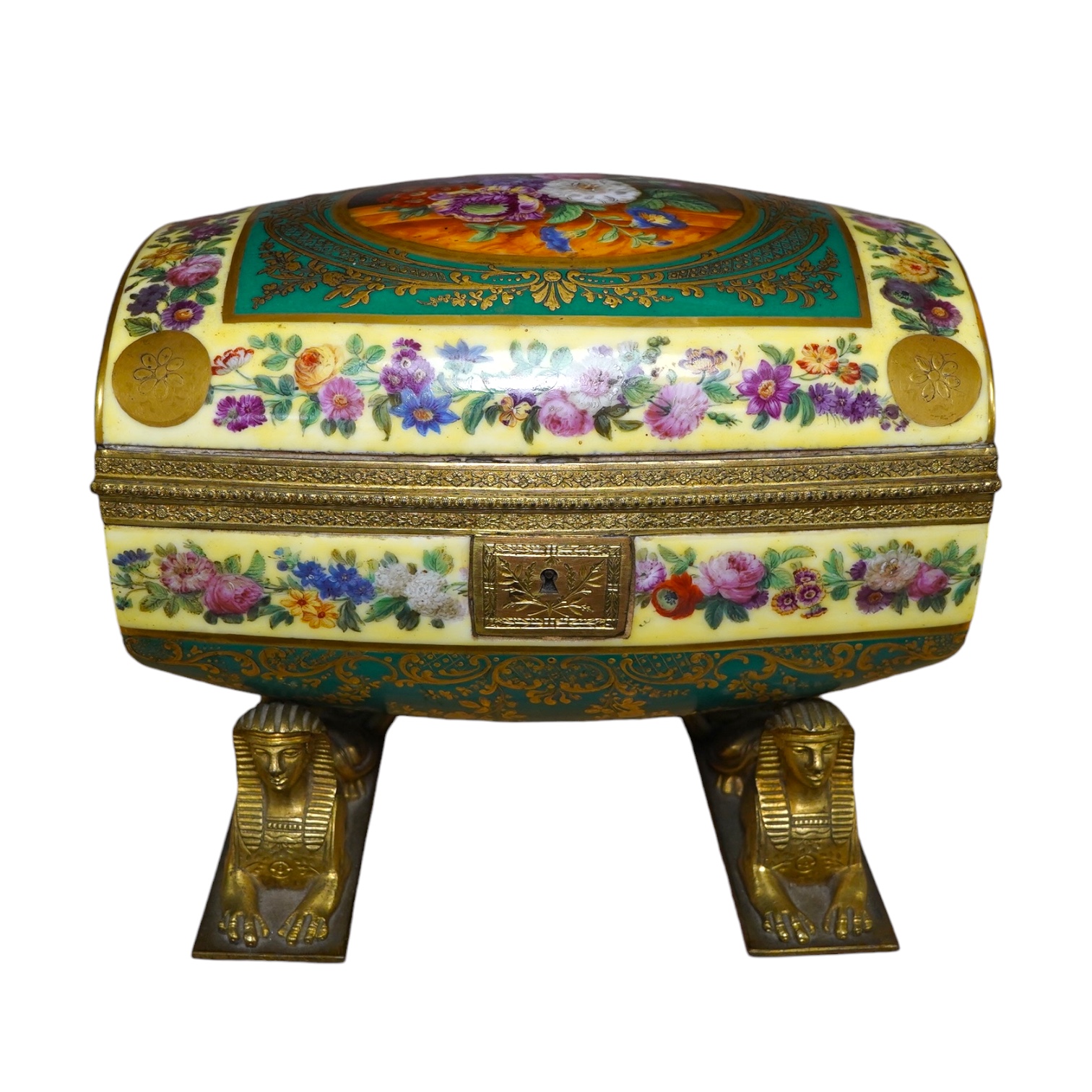 An early 20th century Sevres style sarcophagus shaped casket, on twin sphinx ormolu base, 24cm. Condition - good                                                                                                            