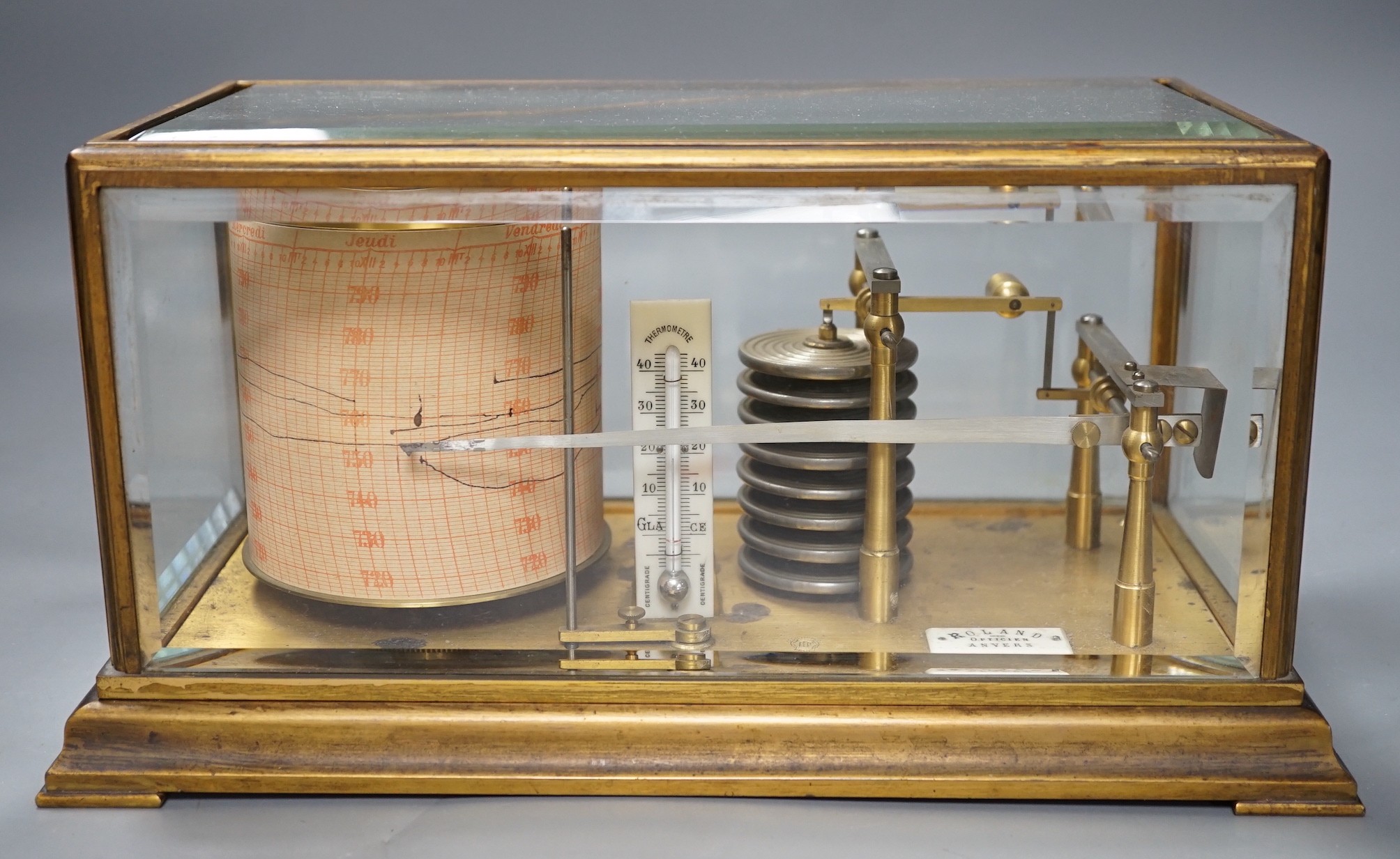 A French brass cased barograph, early 20th century, retailed by Roland, Anvers, number 65830, with ivory thermometer scale and retailers plaque, 30 cm wide                                                                 