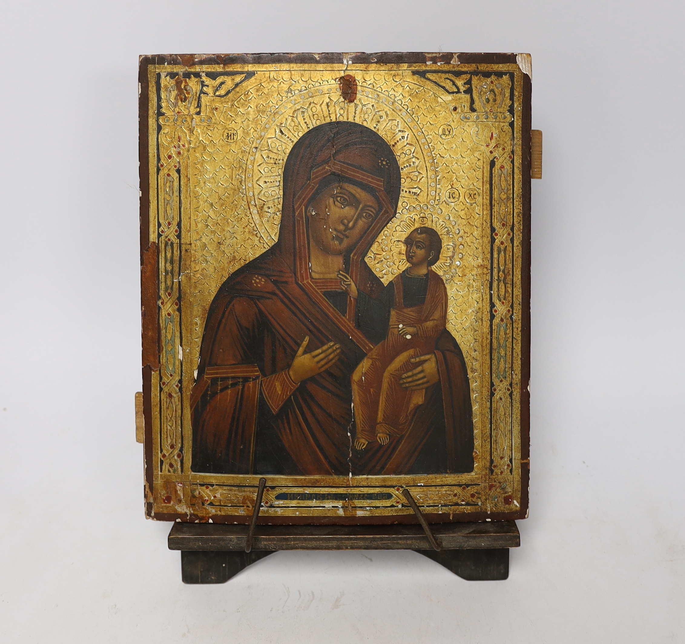 Late 19th century Russian School, hand painted Icon on panel, with stand, 26 x 21cm, unframed                                                                                                                               