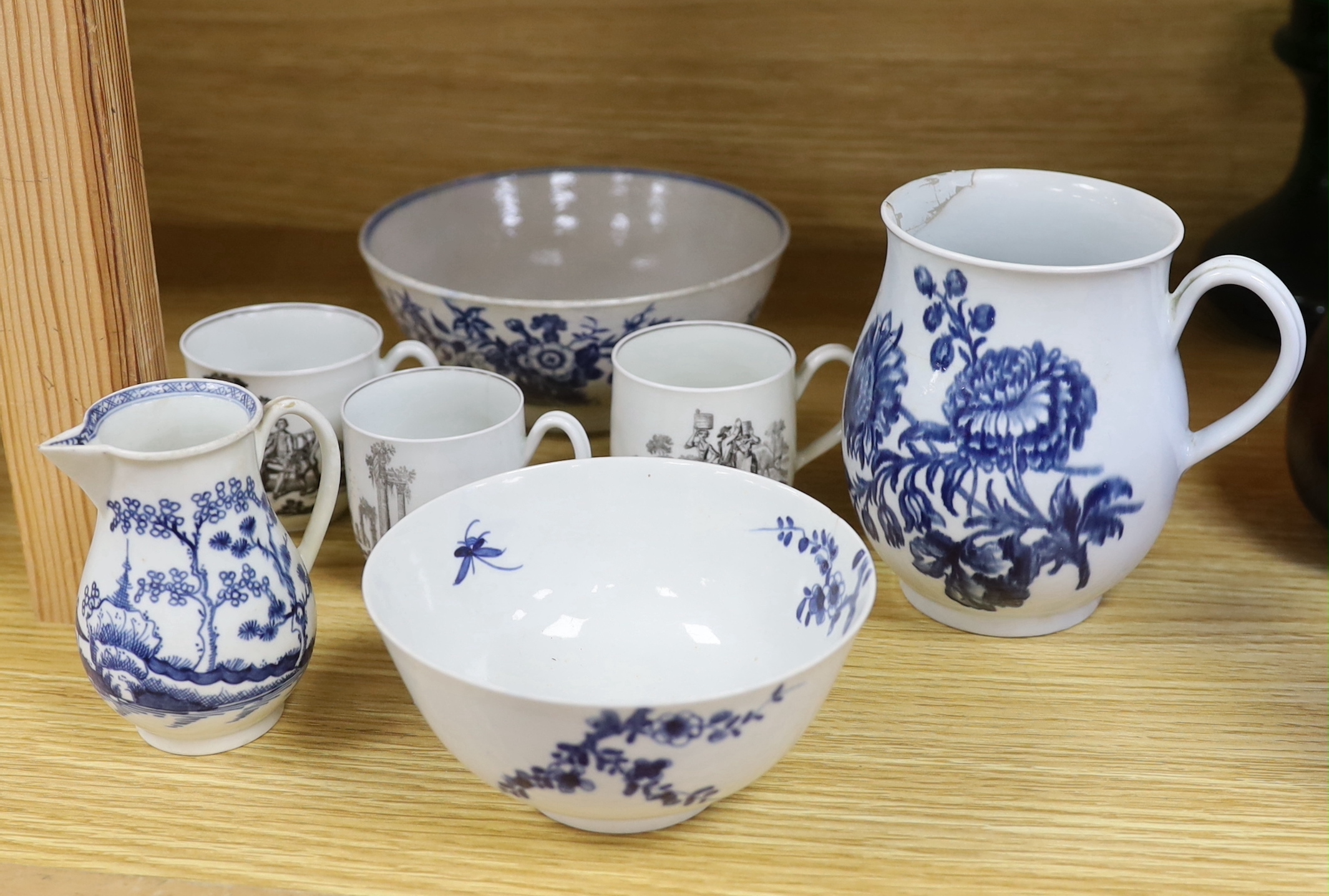 18th century Worcester comprising two floral bowls, two jugs, and three transfer printed cups, the largest 15cm in diameter (7)                                                                                             