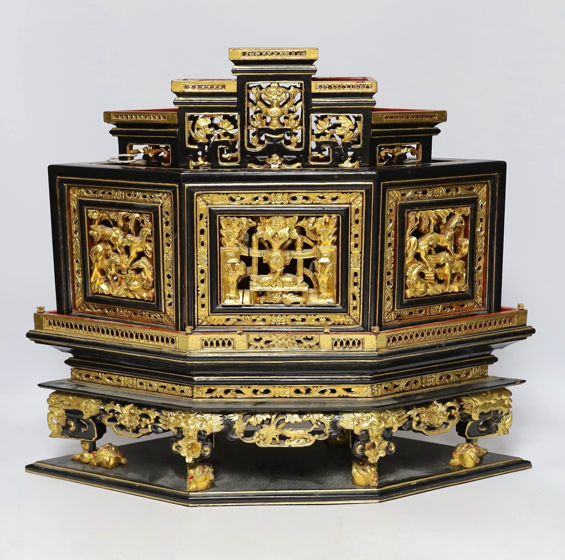 A 20th century Chinese carved lacquered wood altar stand, 49cm wide                                                                                                                                                         