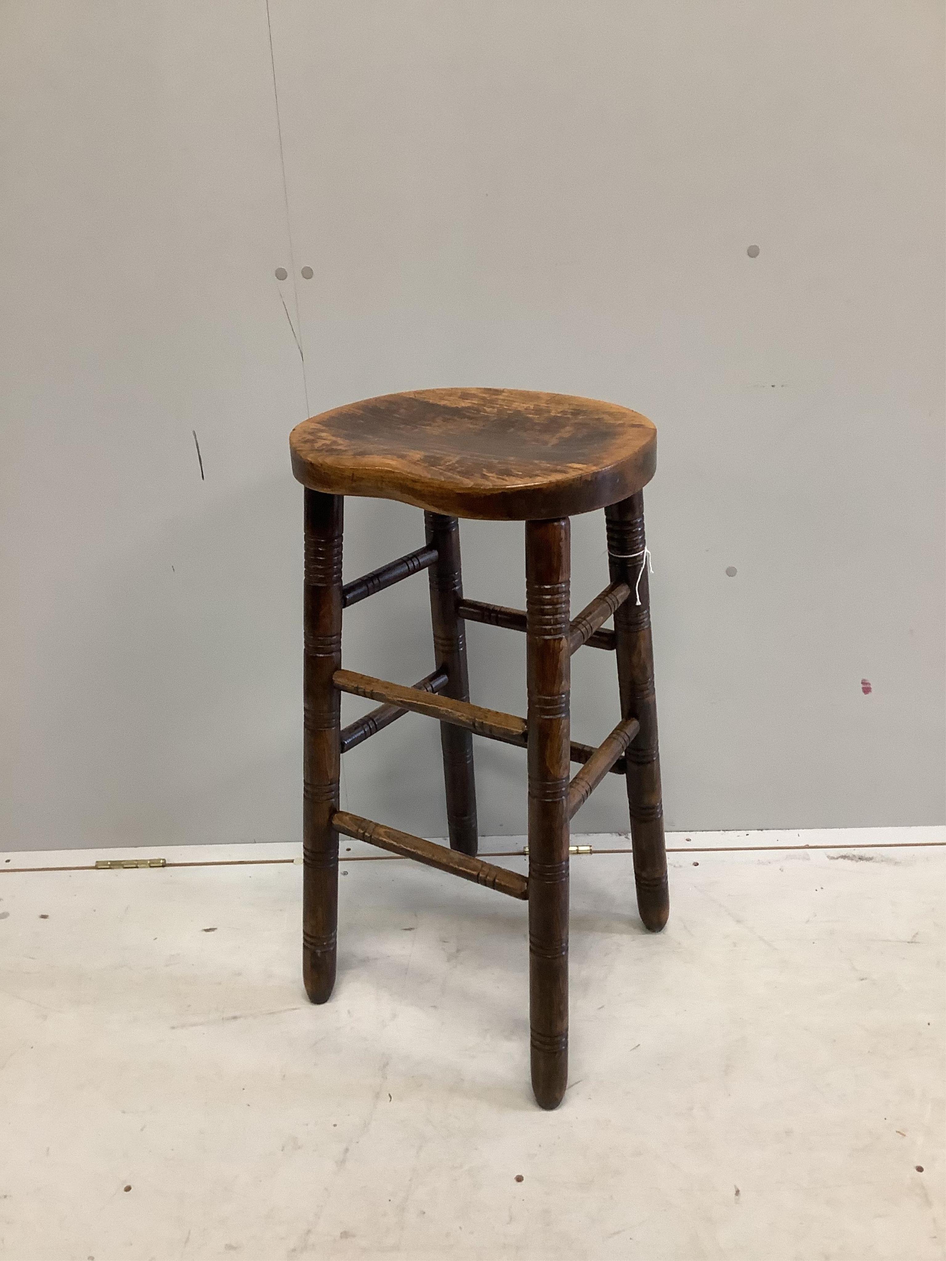 A vintage beech bar stool, height 76cm. Condition - fair to good                                                                                                                                                            