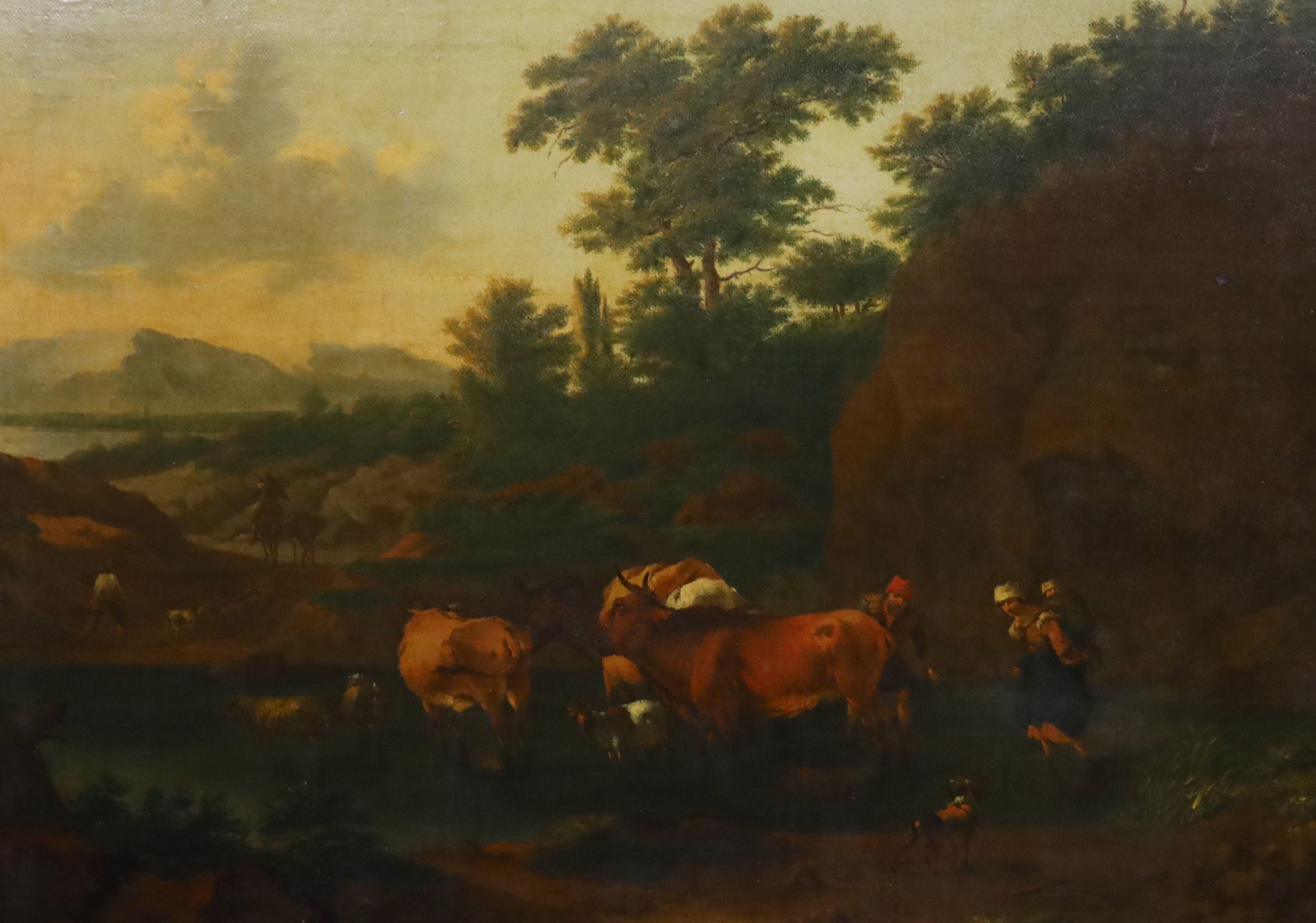 Attributed to Nicholaes Berchem (Dutch, 1620-1683), Landscape with cattle drovers crossing a river, oil on canvas laid onto a wooden panel, 41 x 57cm                                                                       