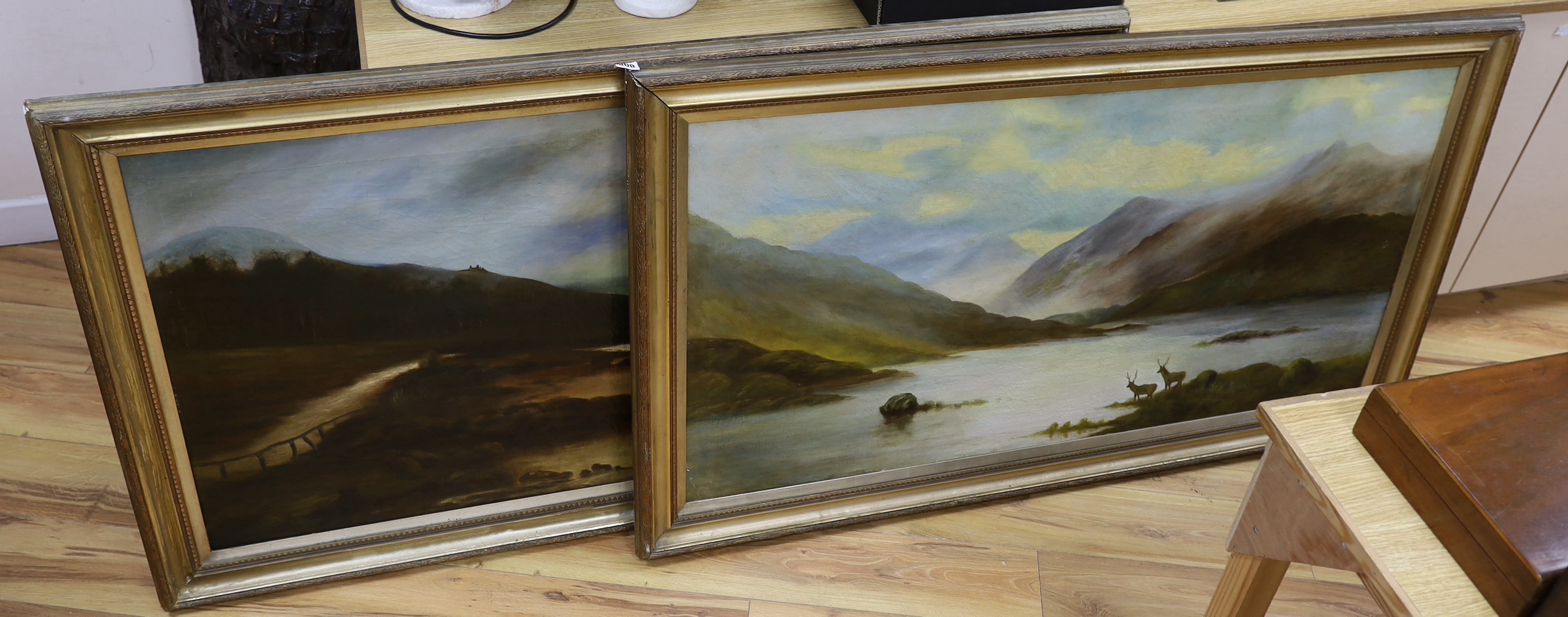 Victorian School, pair of oils on canvas, Extensive landscapes, Deer before mountains and River landscape, unsigned, each 63 x 126cm                                                                                        