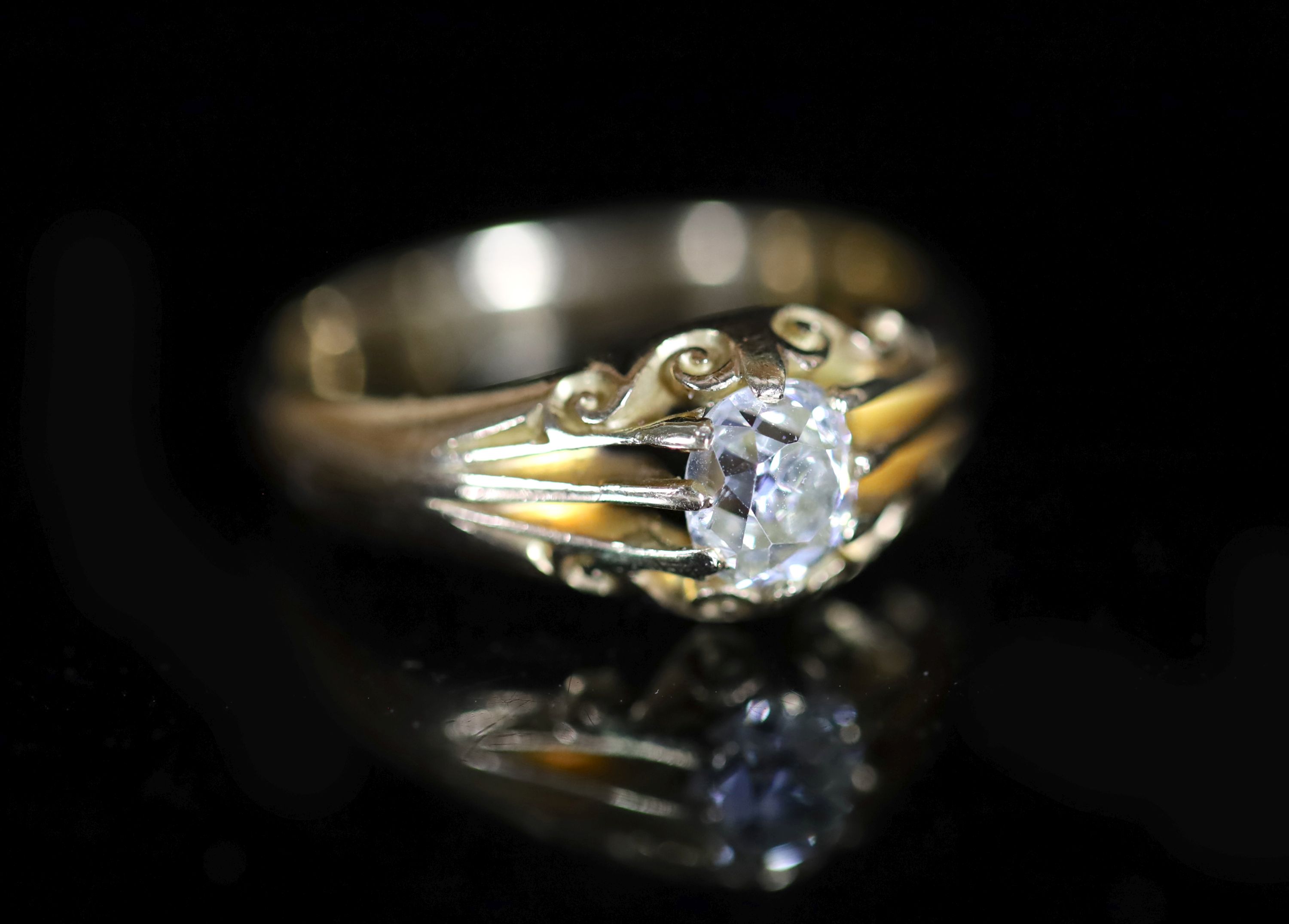 An early 20th century 18ct gold and claw set solitaire diamond ring                                                                                                                                                         