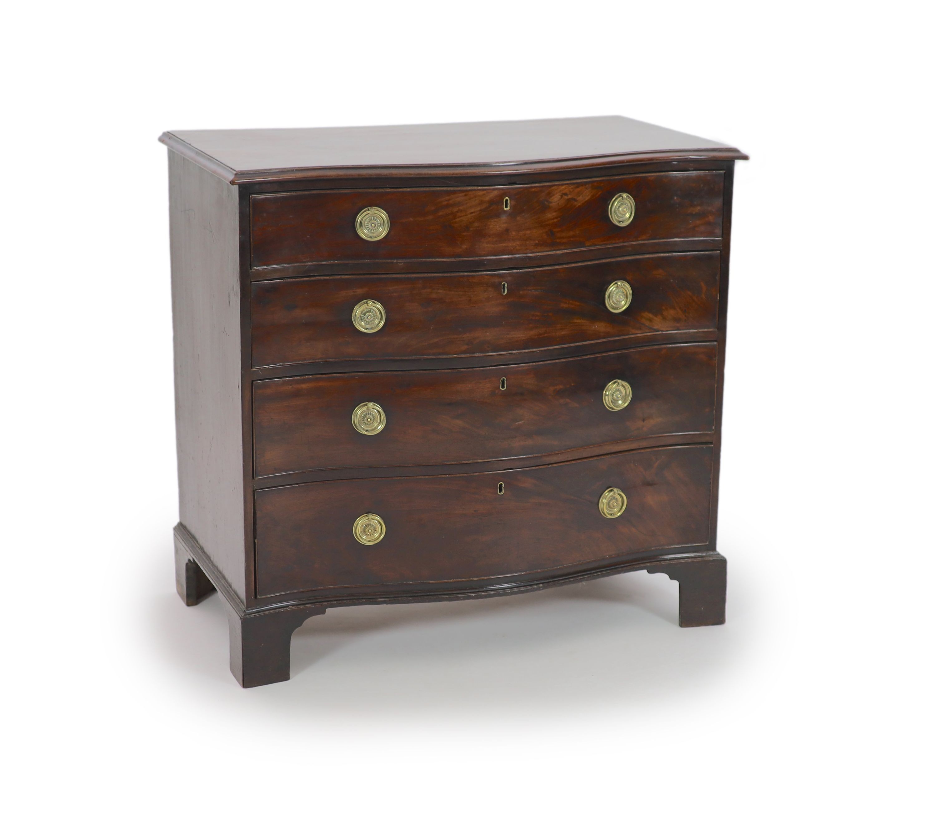 A George III mahogany serpentine chest of four graduated long drawers, W 95cm. D 55cm. H 90.5cm.                                                                                                                            