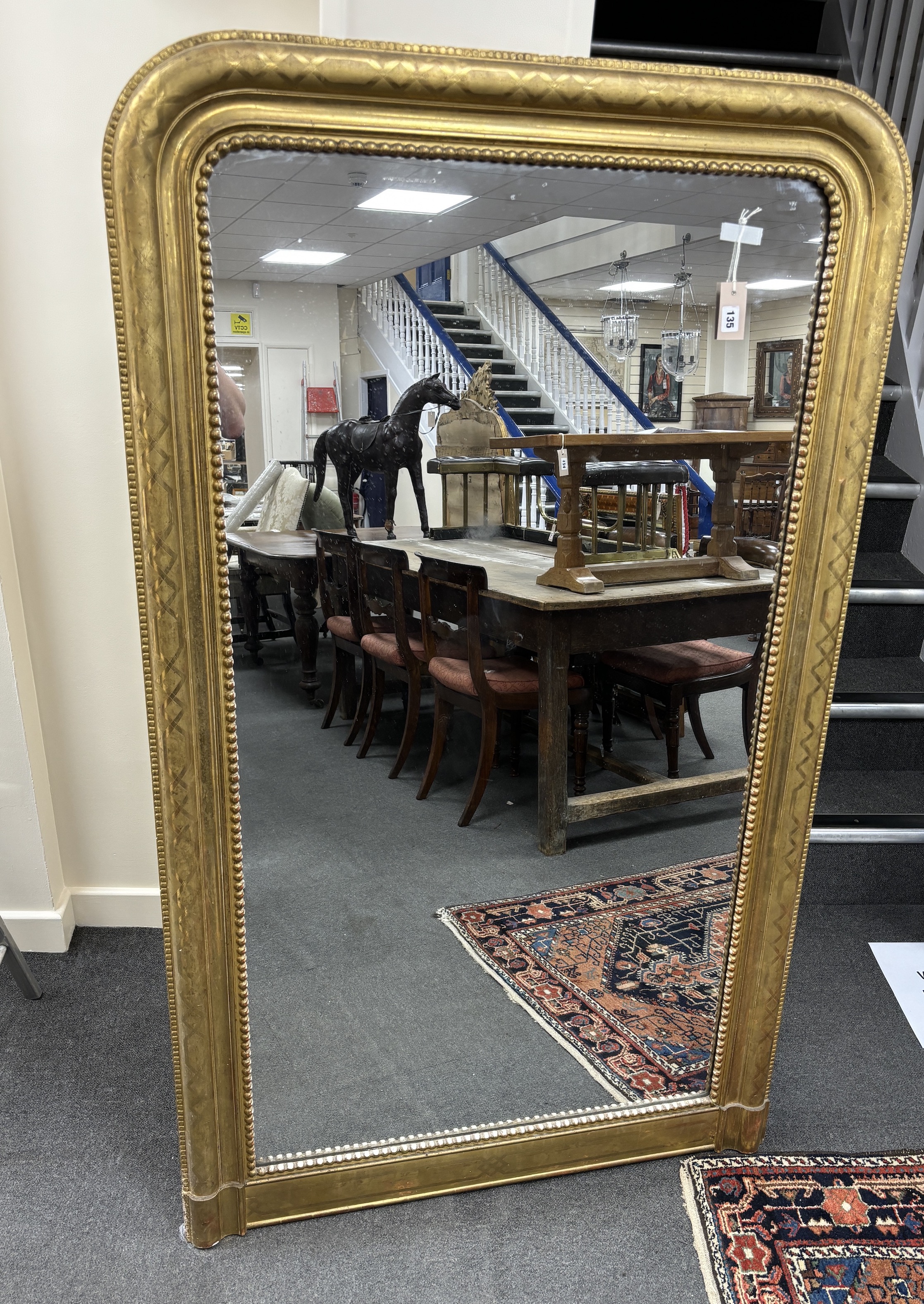 A 19th century French giltwood and composition overmantel mirror, width 101cm, height 167cm                                                                                                                                 