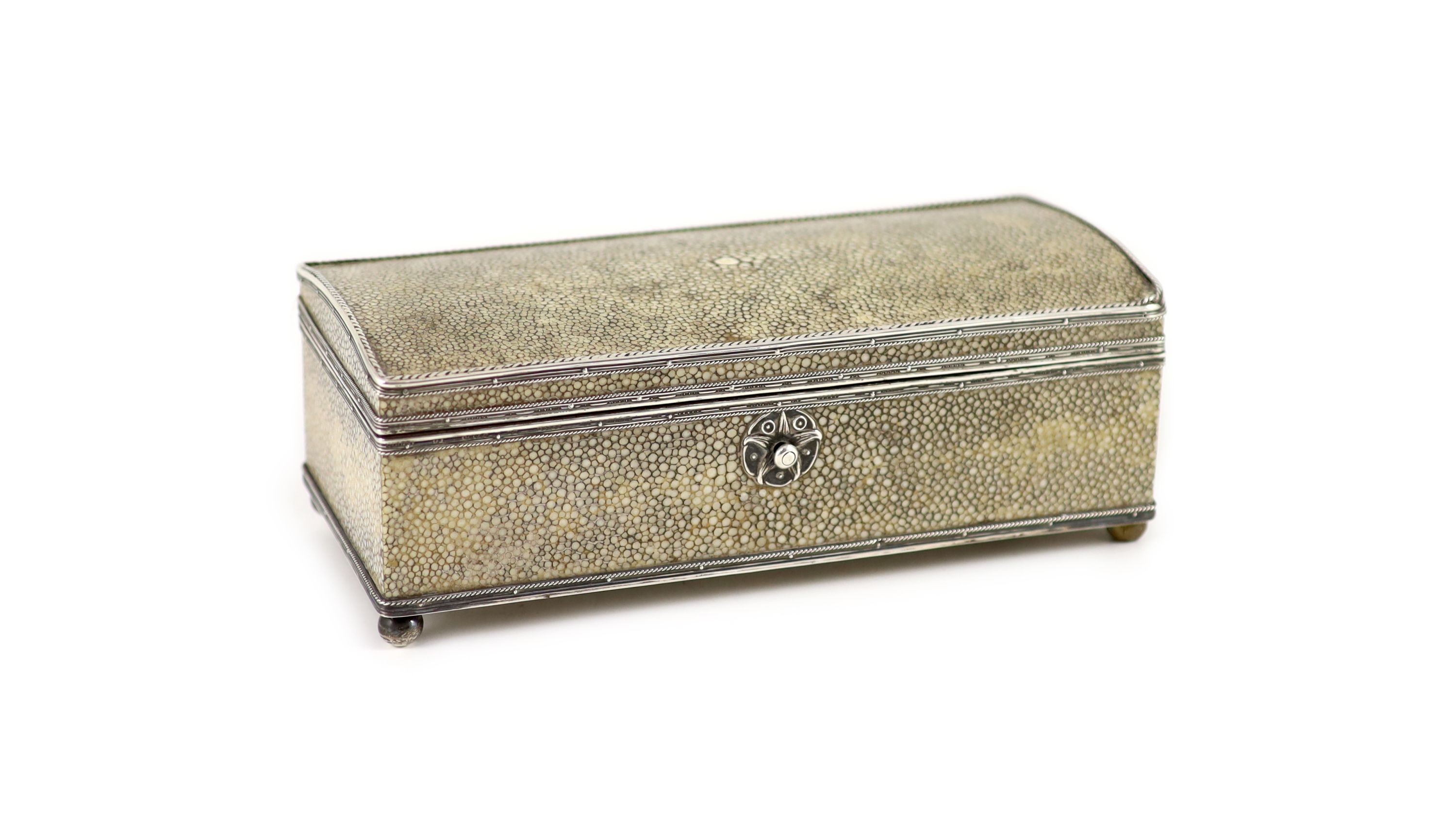 An Arts and Crafts silver mounted shagreen rectangular cigarette box, by John Paul Cooper                                                                                                                                   