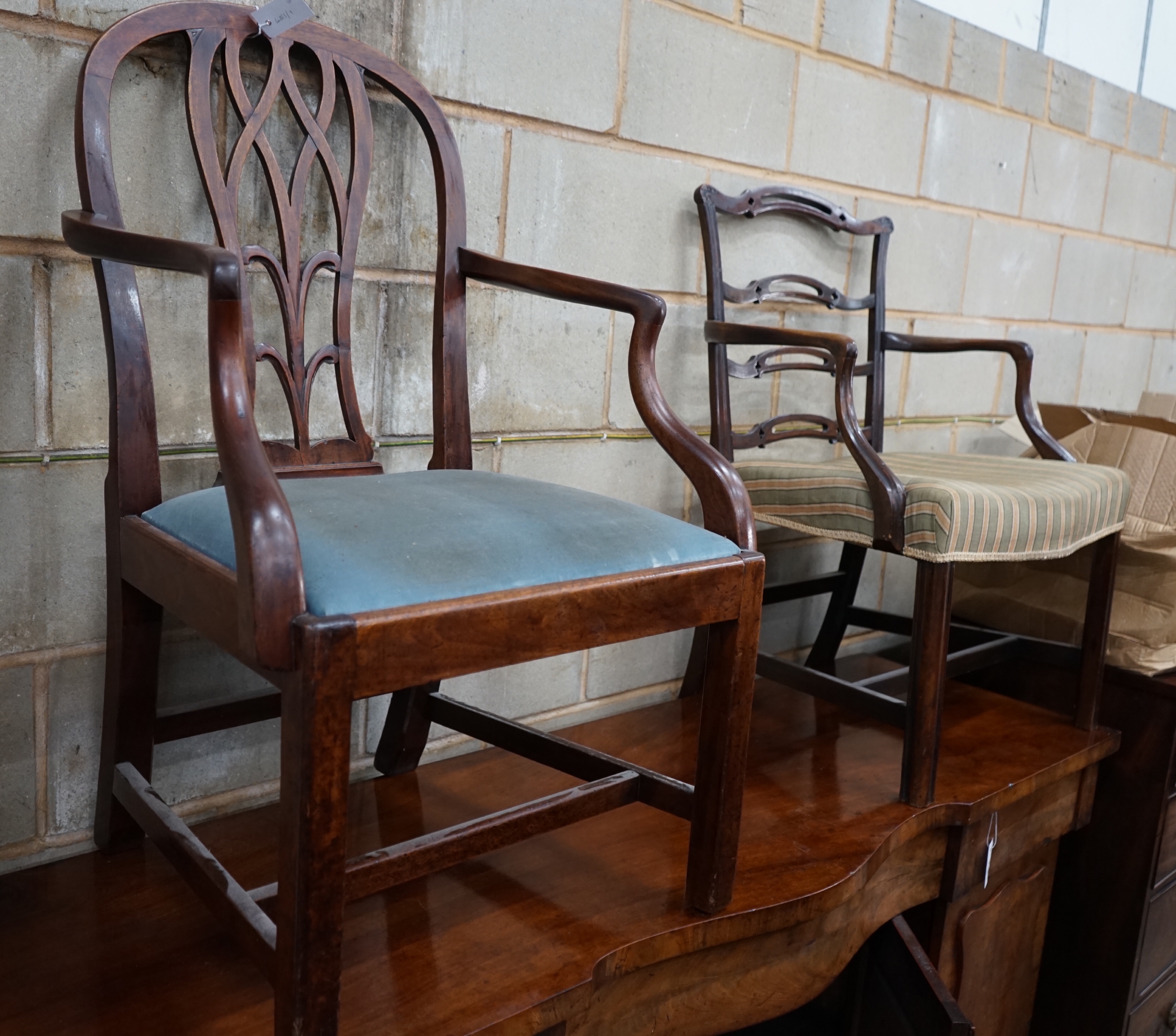 A George III mahogany ladderback elbow chair and a George III Hepplewhite period elbow chair                                                                                                                                