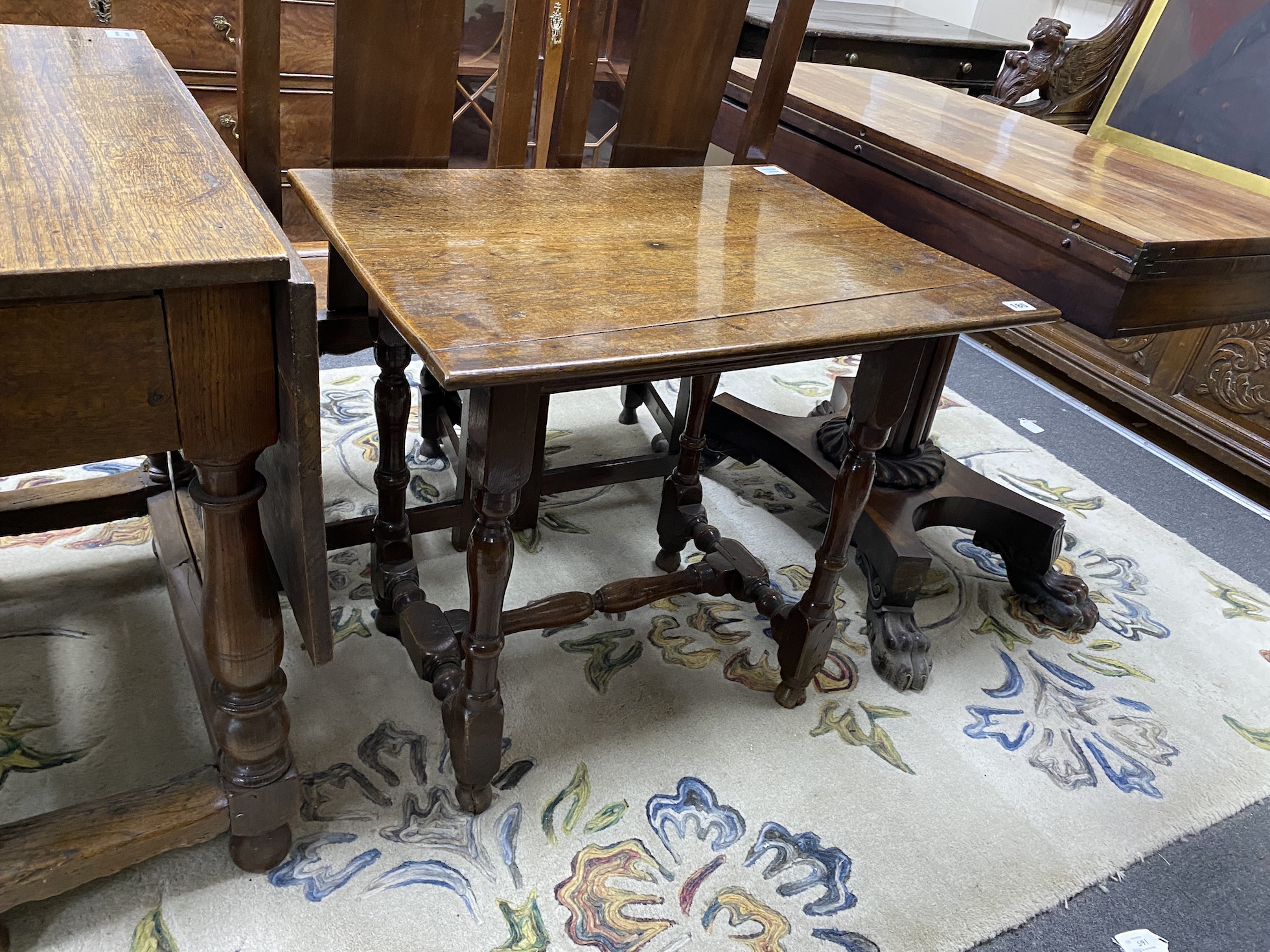 A Charles II small oak centre table, c.1680, the rectangular top over a shaped apron, square and turned legs joined by an H stretcher, width 70cm, depth 54cm, height 64cm                                                  