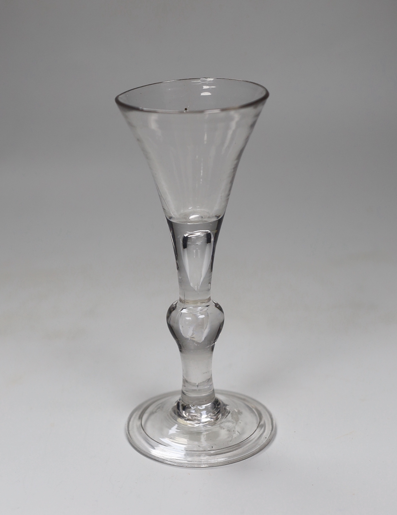 A George II Kit-kat-type wine glass, air-tear and folded foot, 16cm tall                                                                                                                                                    
