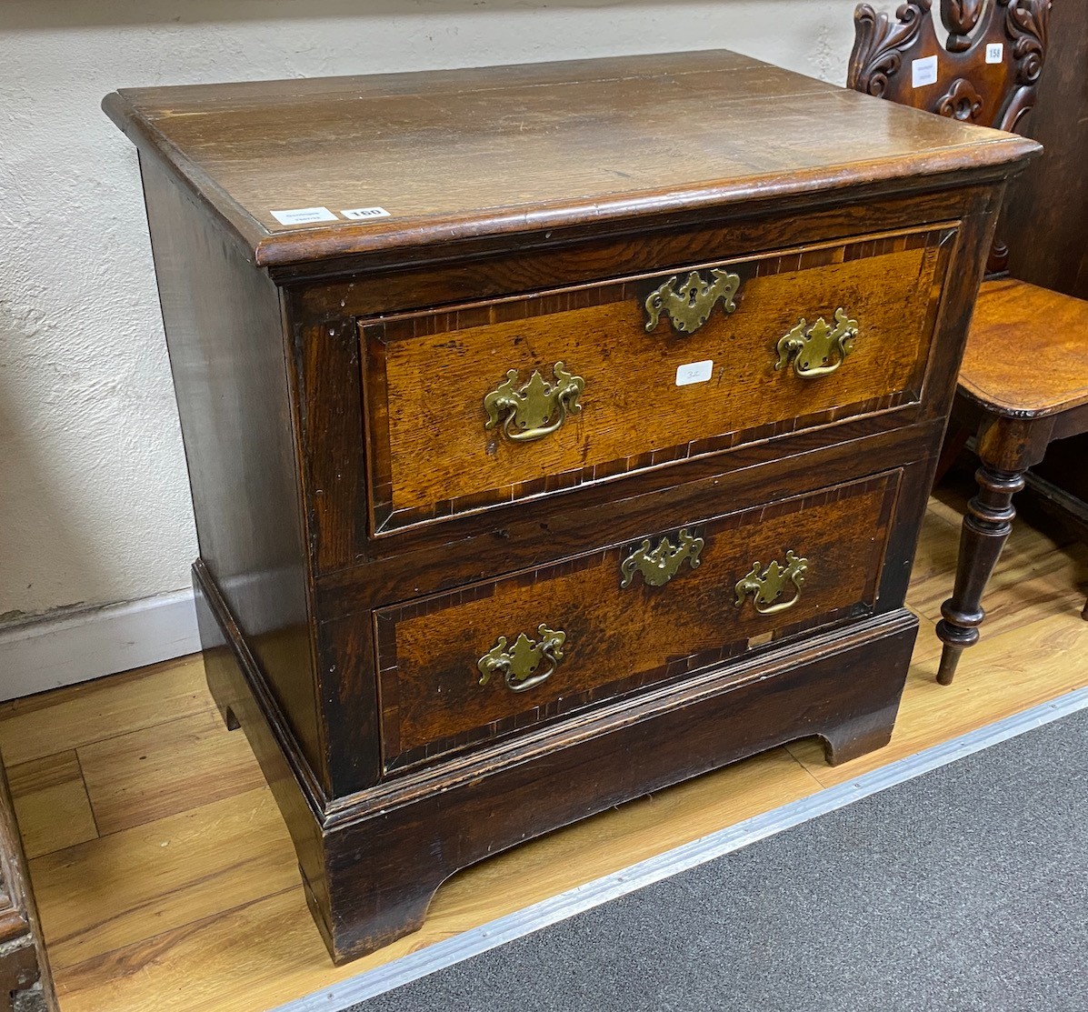 A late 18th century oak and mahogany banded chest of two drawers, width 76cm, depth 49cm, height 75cm                                                                                                                       