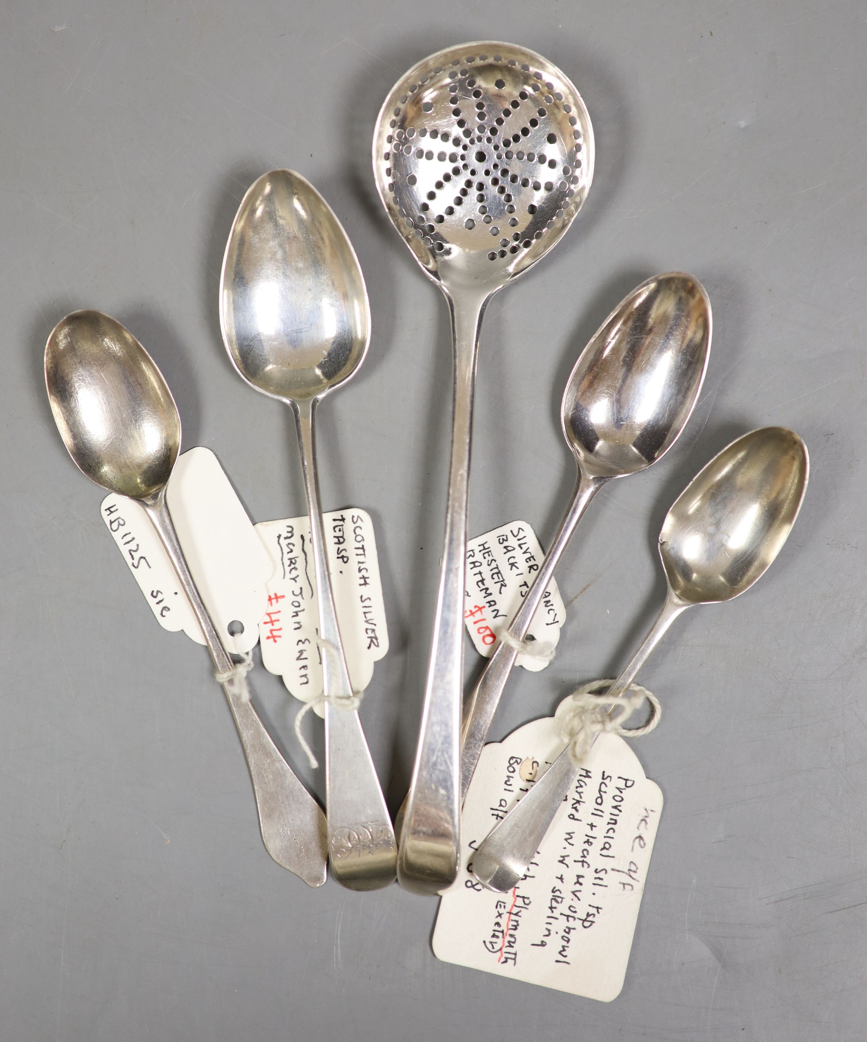 A George III silver lace back Hanovarian pattern teaspoon by Hester Bateman, 11.7cm, an antique dog nose spoon, 11.4cm, two other teaspoons including John Ewan and an unusual sifter spoon stamped twice with dove of peace