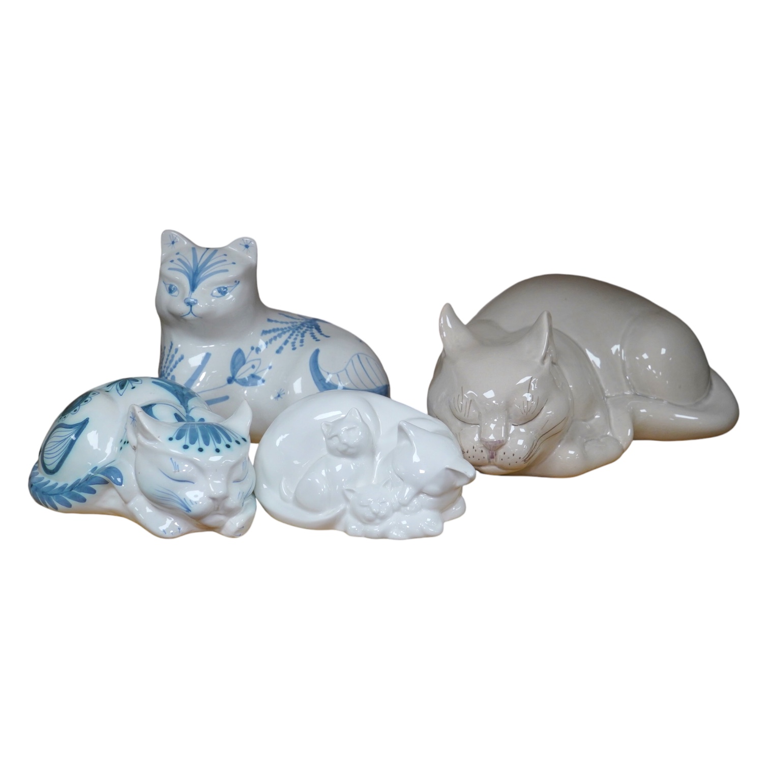 Three large David Sharp Rye pottery models of cats and a Moments by Coalport cat ‘Mothers Love’, tallest 18cm. Condition - largest cat with large firing crack to base otherwise good                                       