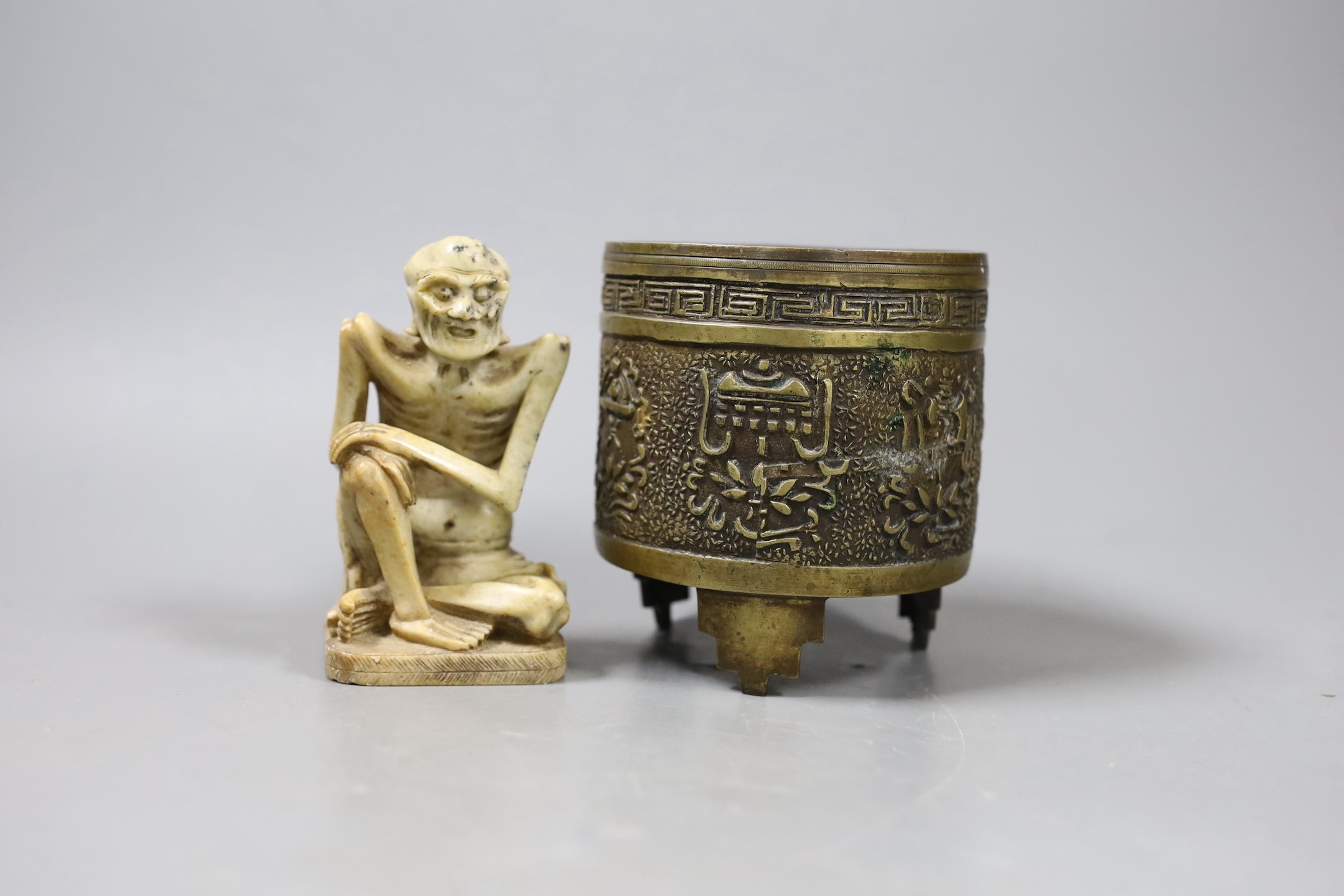 A Chinese archaistic bronze censer and a soapstone figure of a luohan, Tallest 10cm                                                                                                                                         