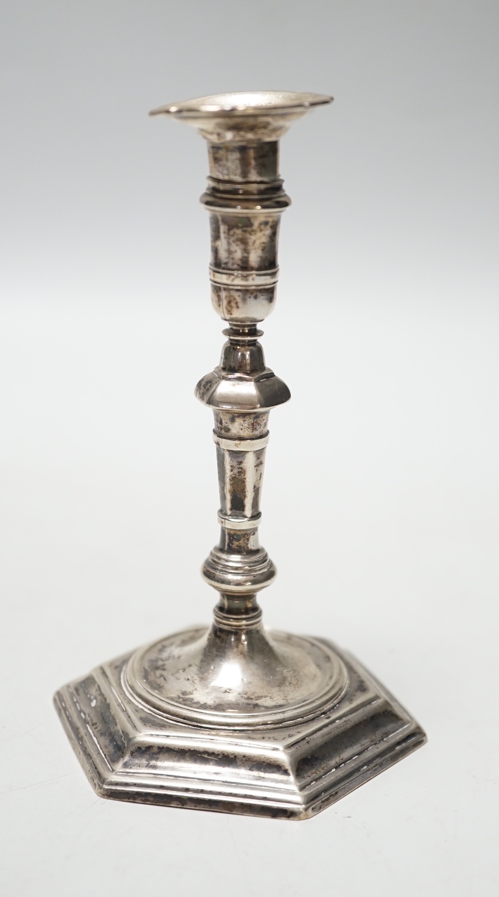 A George II cast silver taper stick, James Gould, London, 1732, 10.8cm, 3oz, with later? unmarked sconce.                                                                                                                   