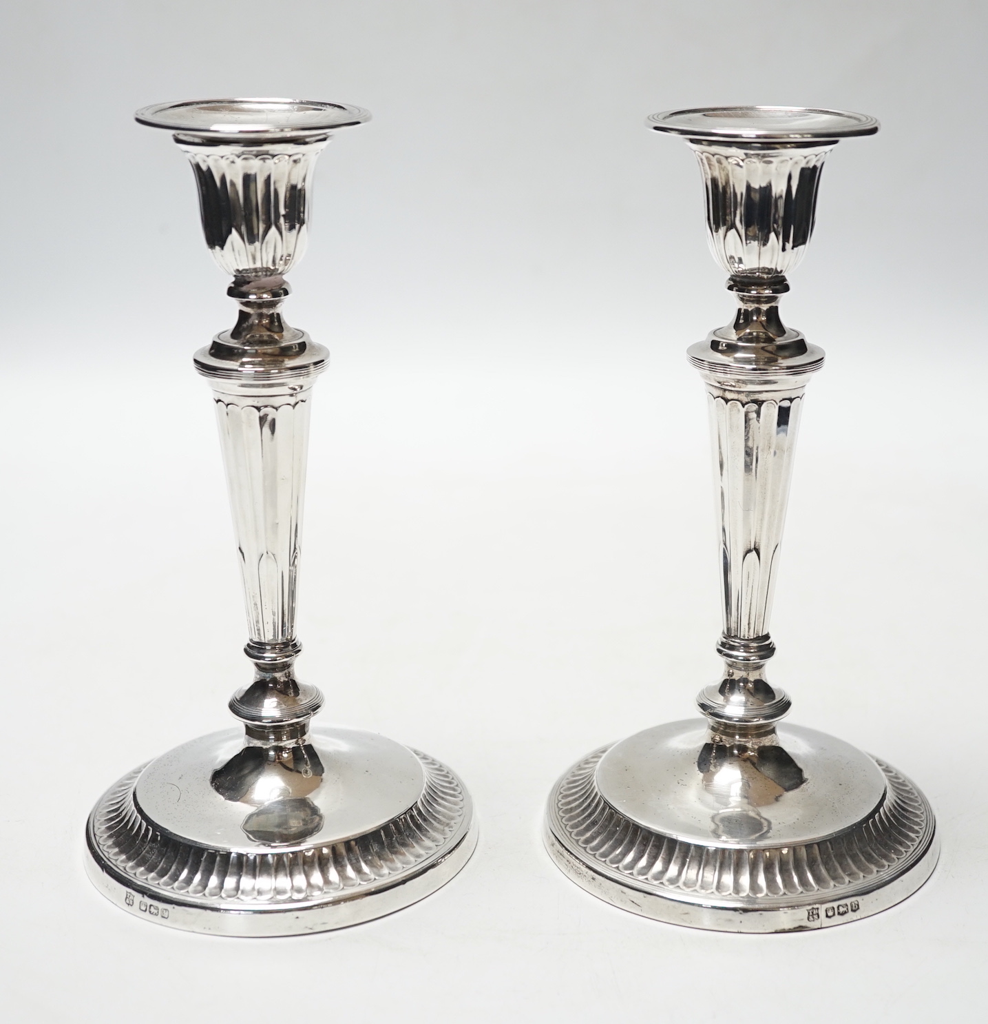 A pair of George V silver mounted candlesticks, Thomas Bradbury & Sons, Sheffield, 1919, 18.6cm, weighted.                                                                                                                  