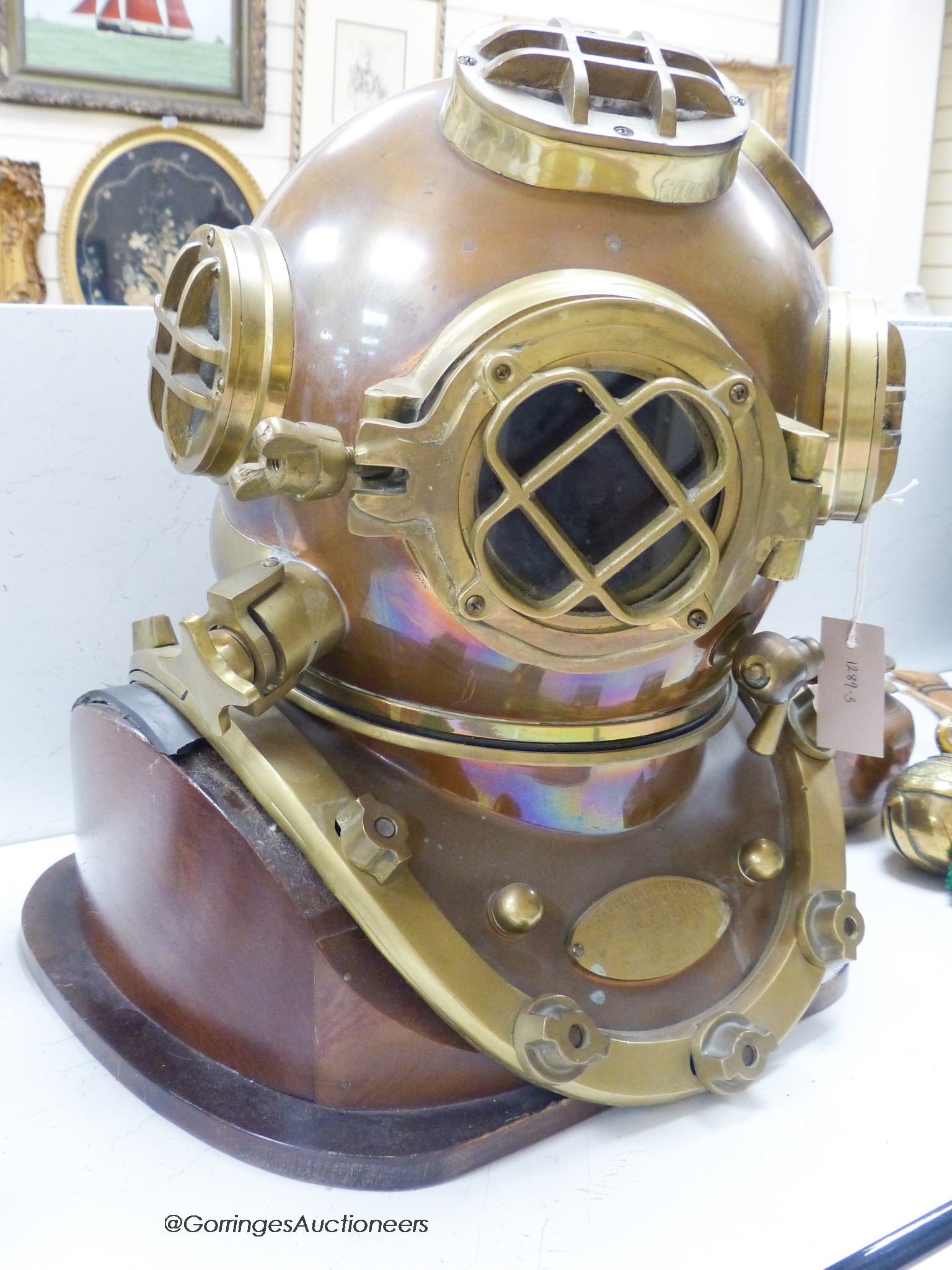 A copper and brass full size model of a diver's helmet, mounted as a lamp, height 46cm                                                                                                                                      