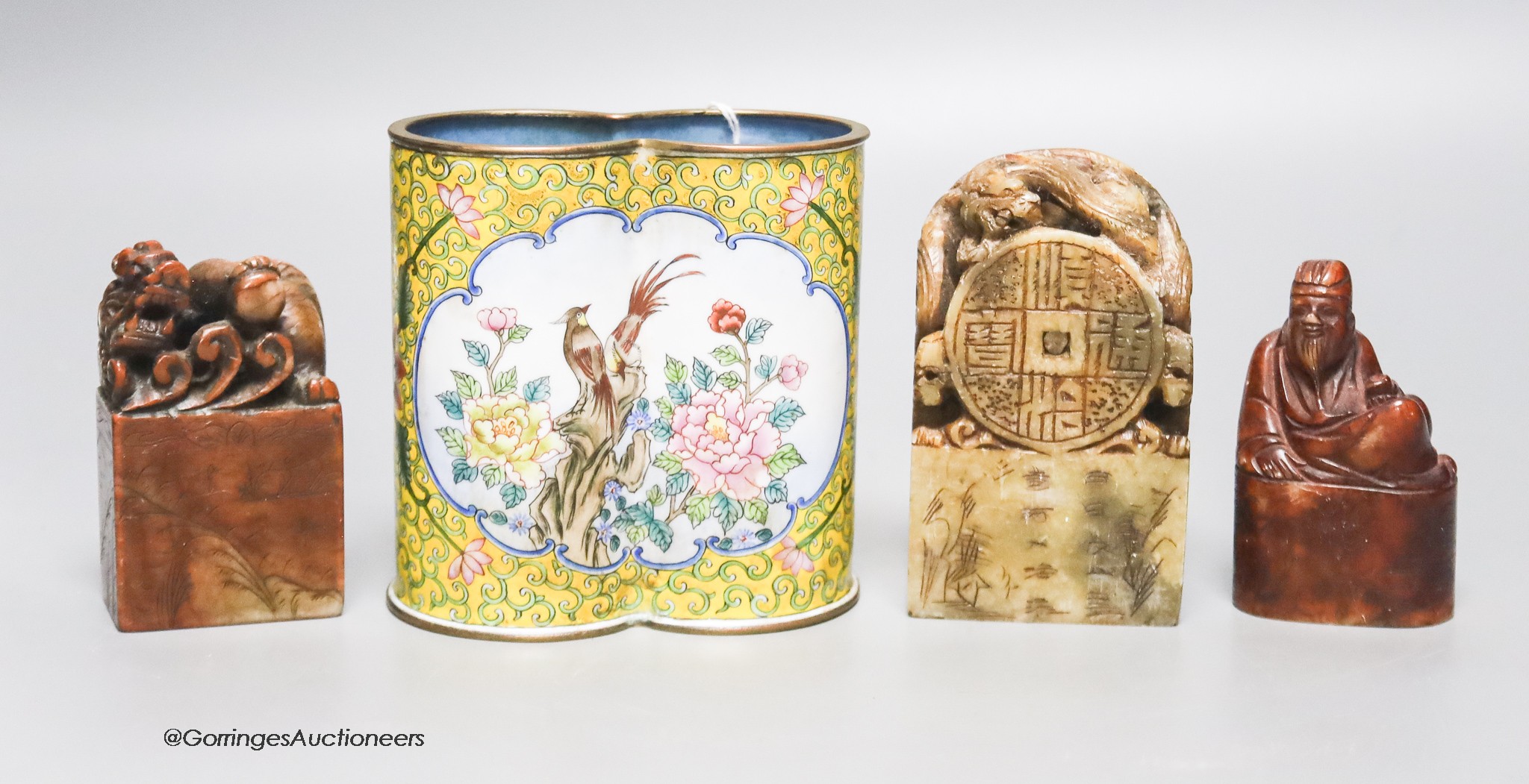 A Chinese enamel on copper brush pot together with three soapstone seals, 10cm                                                                                                                                              