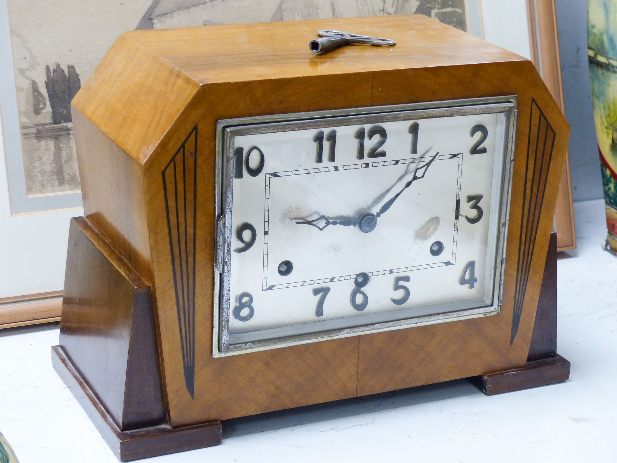 An Art Deco walnut cased eight day mantel clock, 32.5 cm wide                                                                                                                                                               