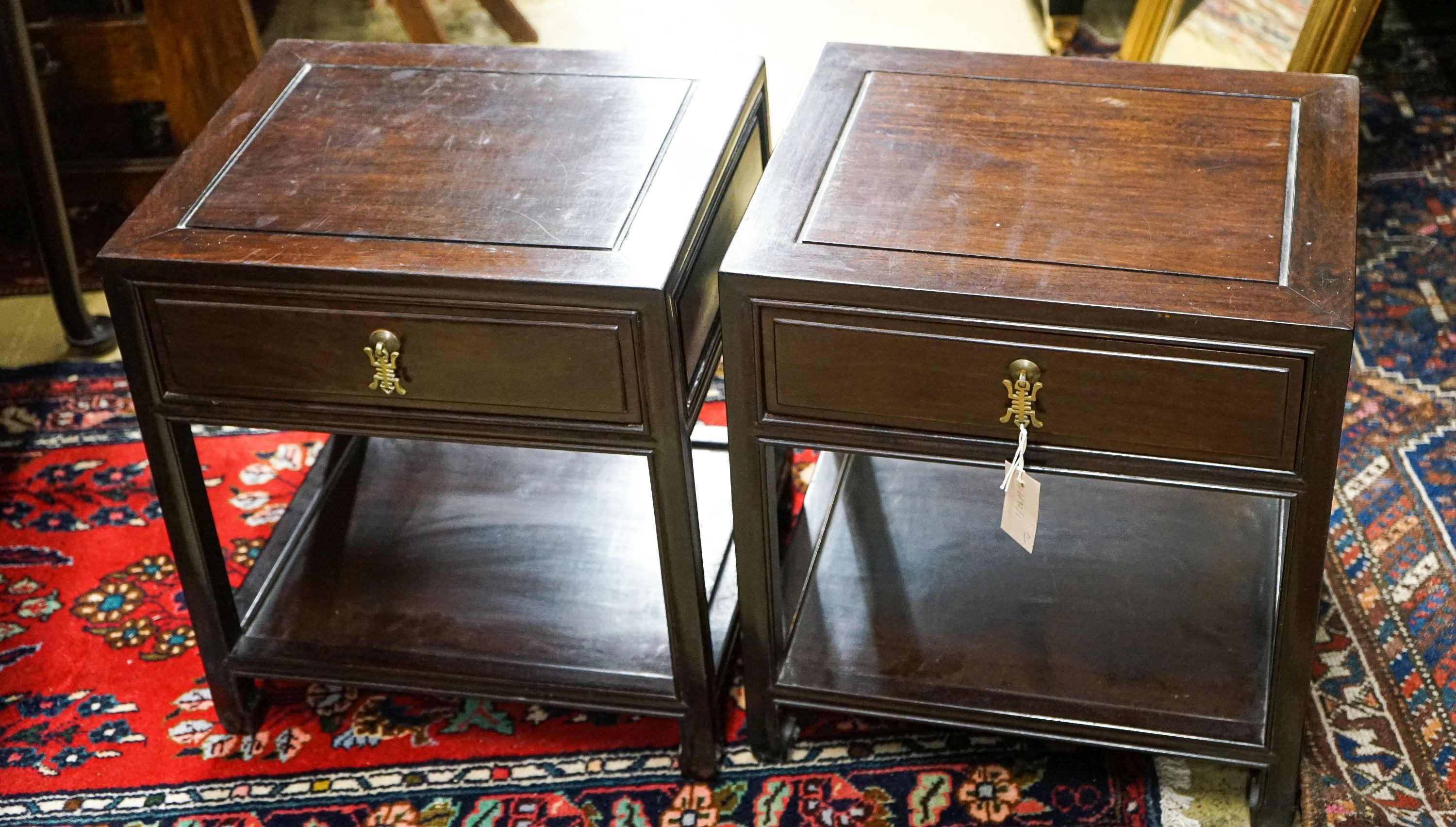 A pair of Chinese hardwood bedside tables, width 46cm, depth 38cm, height 51cm                                                                                                                                              