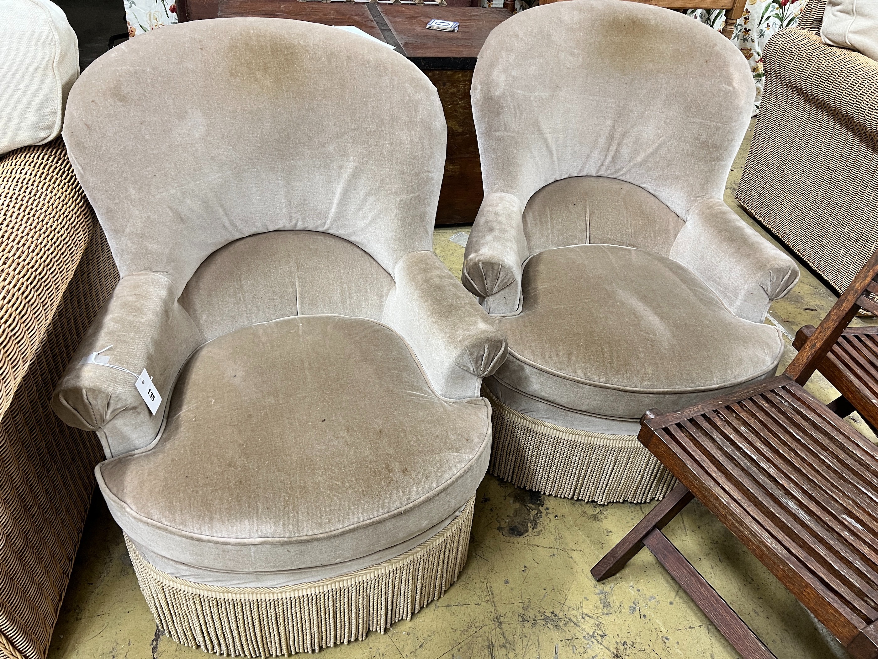 A pair of upholstered tub framed side chairs, width 70cm, depth 70cm, height 88cm                                                                                                                                           