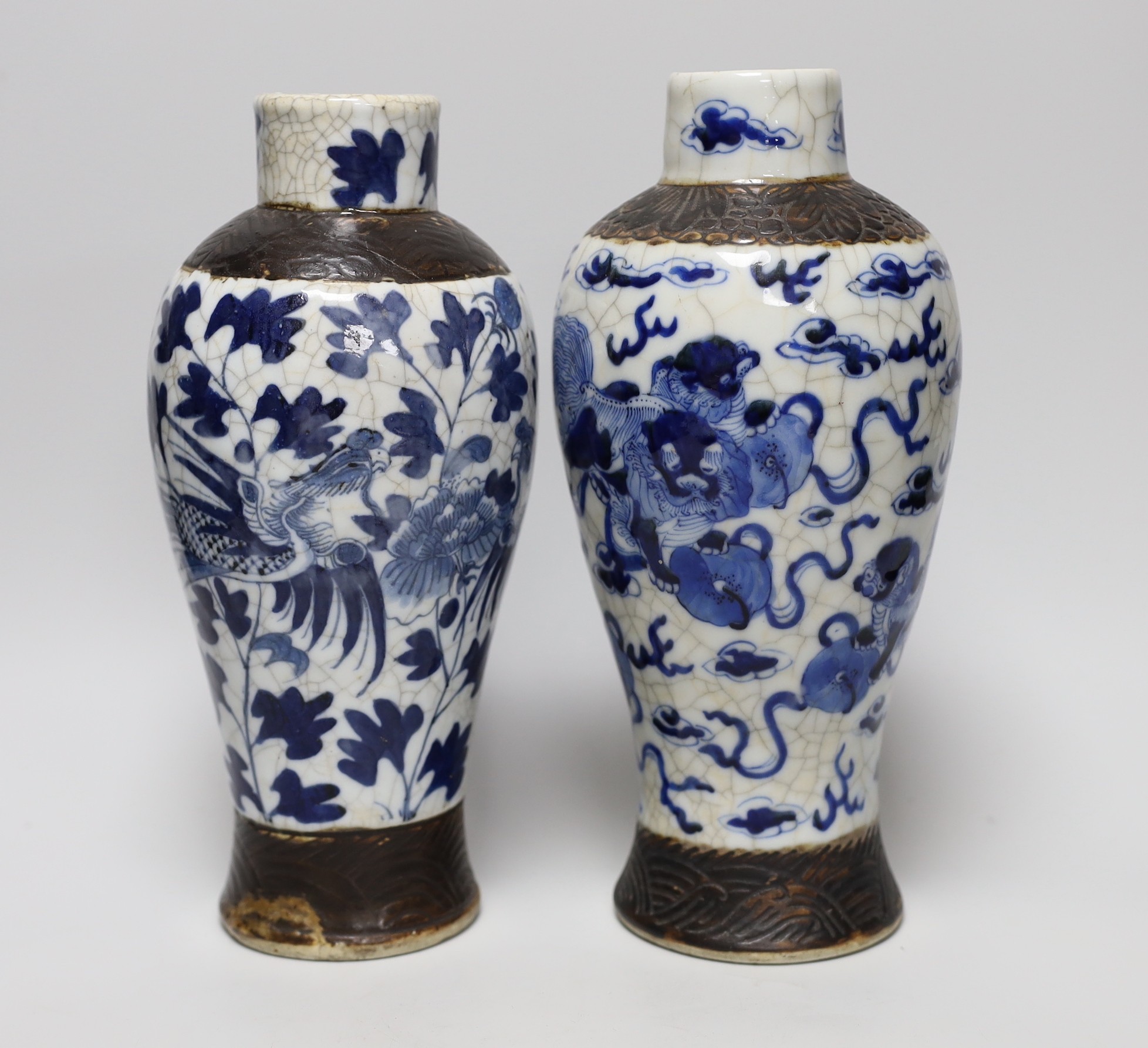 A pair of 19th century Chinese crackleglaze blue and white vases, 27cm                                                                                                                                                      