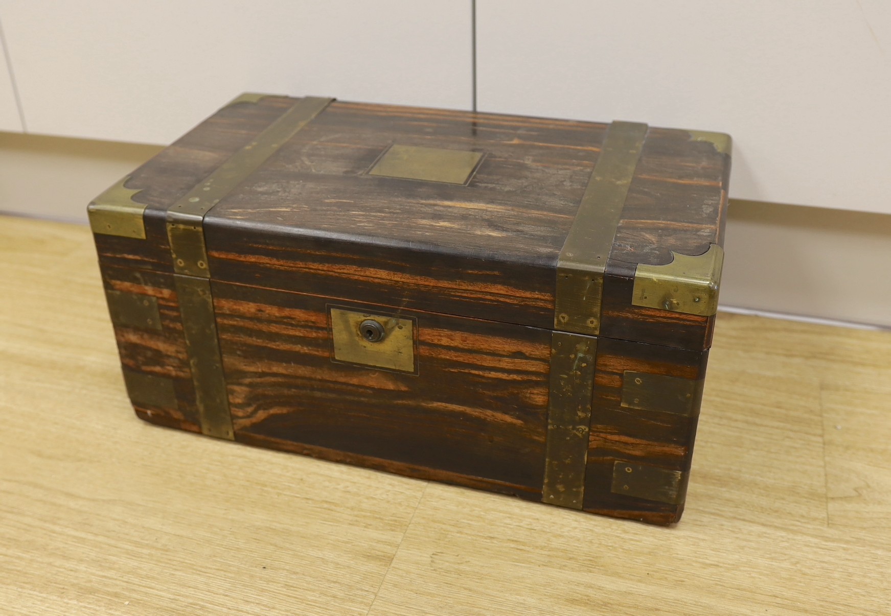 A boxed set of eight Banda carpet bowls, in a Victorian coromandel writing slope (a/f), 35cm wide                                                                                                                           