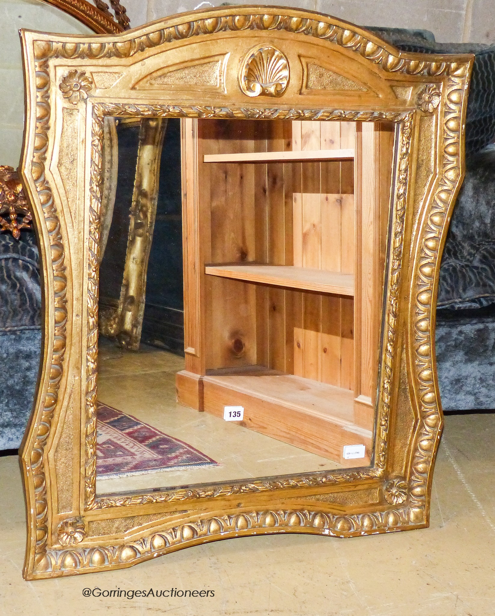 A gilt composition wall mirror in 18th century style                                                                                                                                                                        