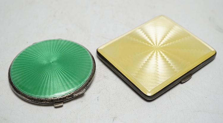 Two George V silver and guilloche enamel compacts, Birmingham 1930 and 1934, 7cm and 8cm. Condition - fair                                                                                                                  