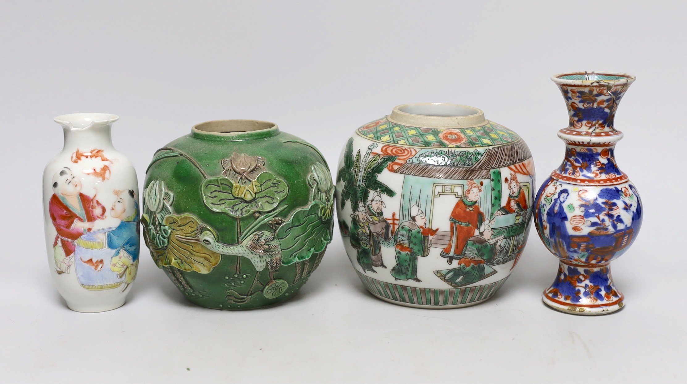 A Chinese famille verte jar, a colour glazed jar, a clobbered Kangxi vase and a Republic 'boys' vase, Kangxi vase 15cm high (4)                                                                                             