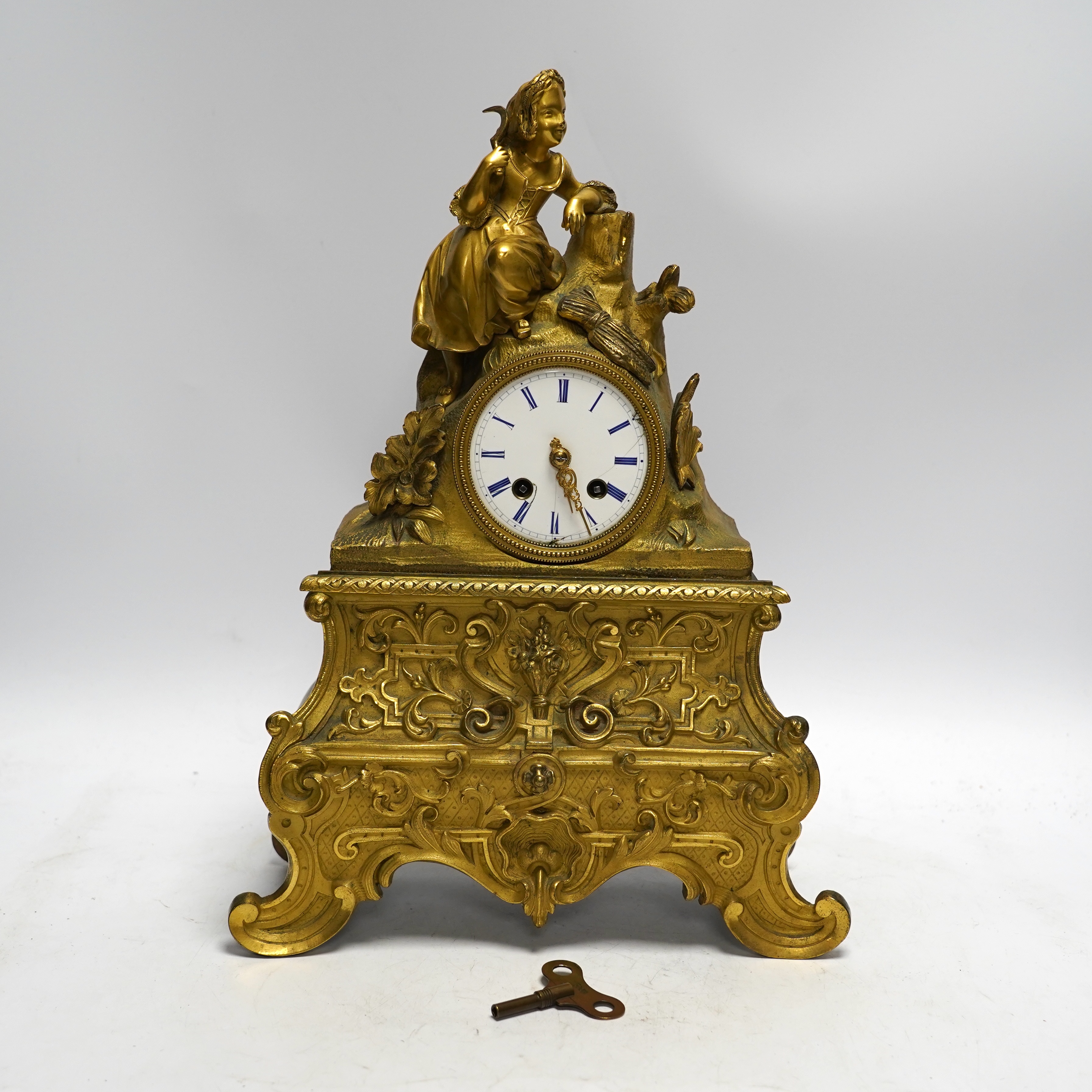 A mid 19th century French ormolu figural mounted clock with silk suspension, with key, 36cm                                                                                                                                 
