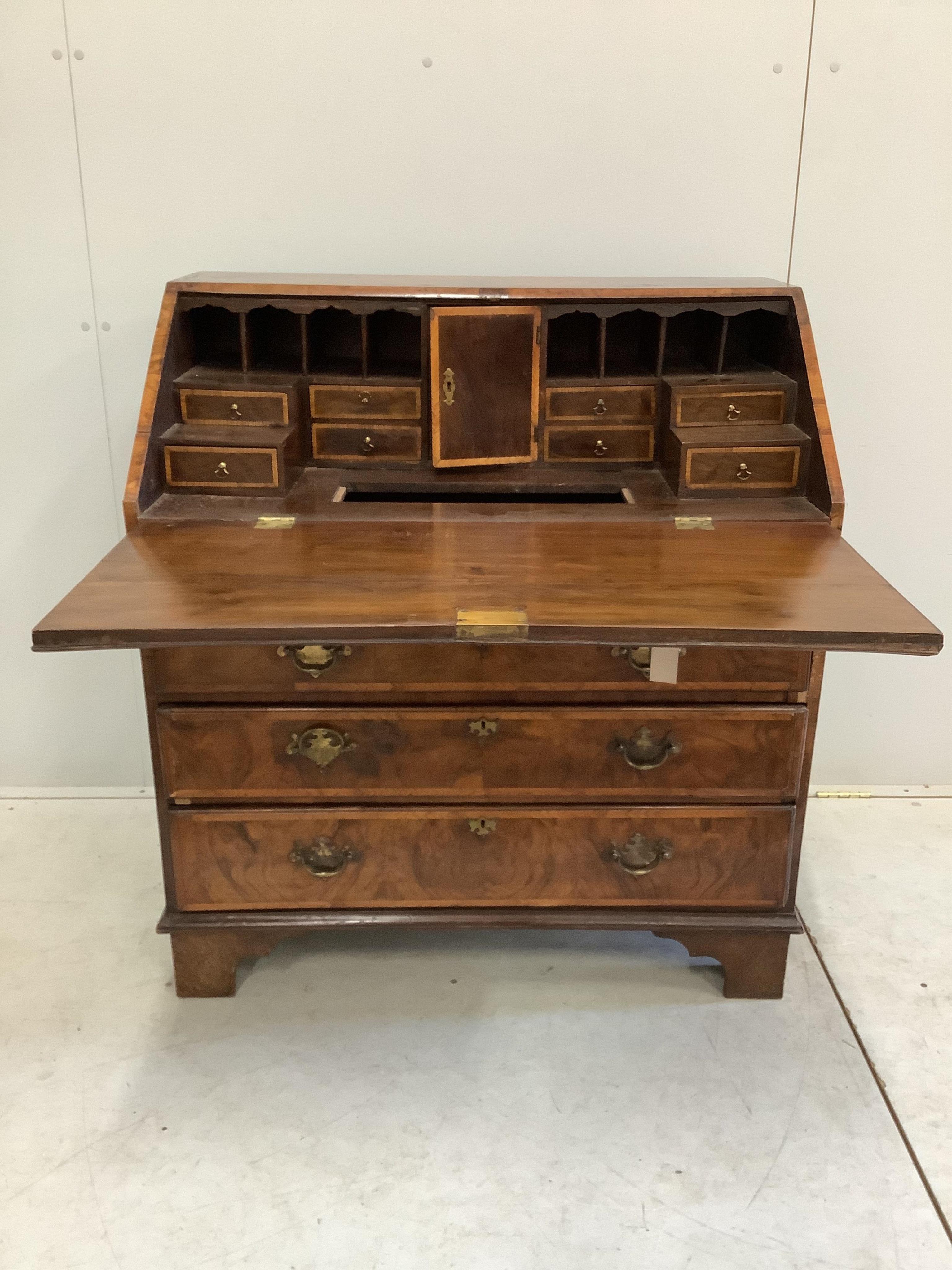 A George I and later feather banded walnut bureau, width 92cm, depth ...