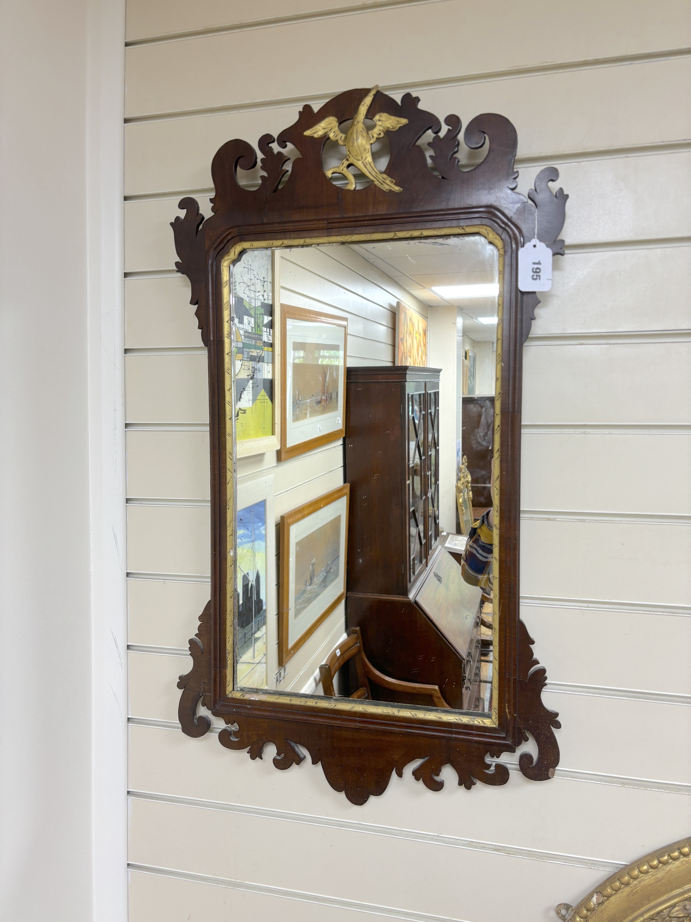 A George III style mahogany fret cut wall mirror, width 47cm, height 86cm                                                                                                                                                   